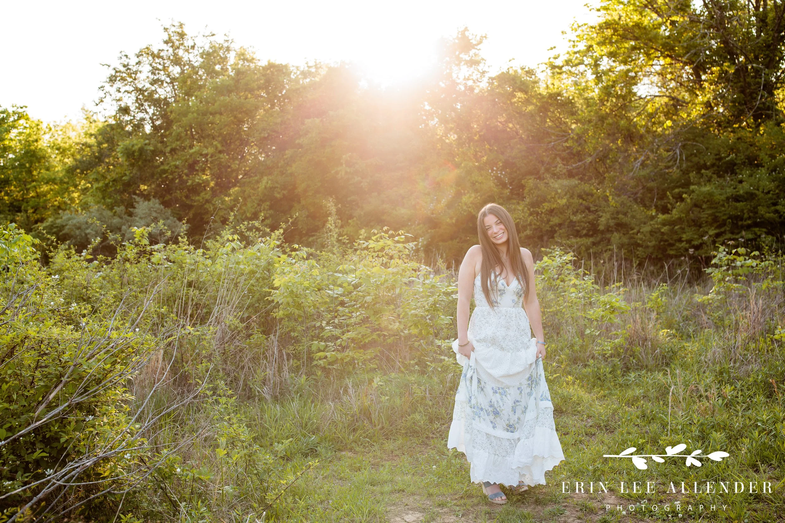 Nashville senior session — high school senior twirling in a field at Walton Ferry Arboretum, dress swirling in natural light