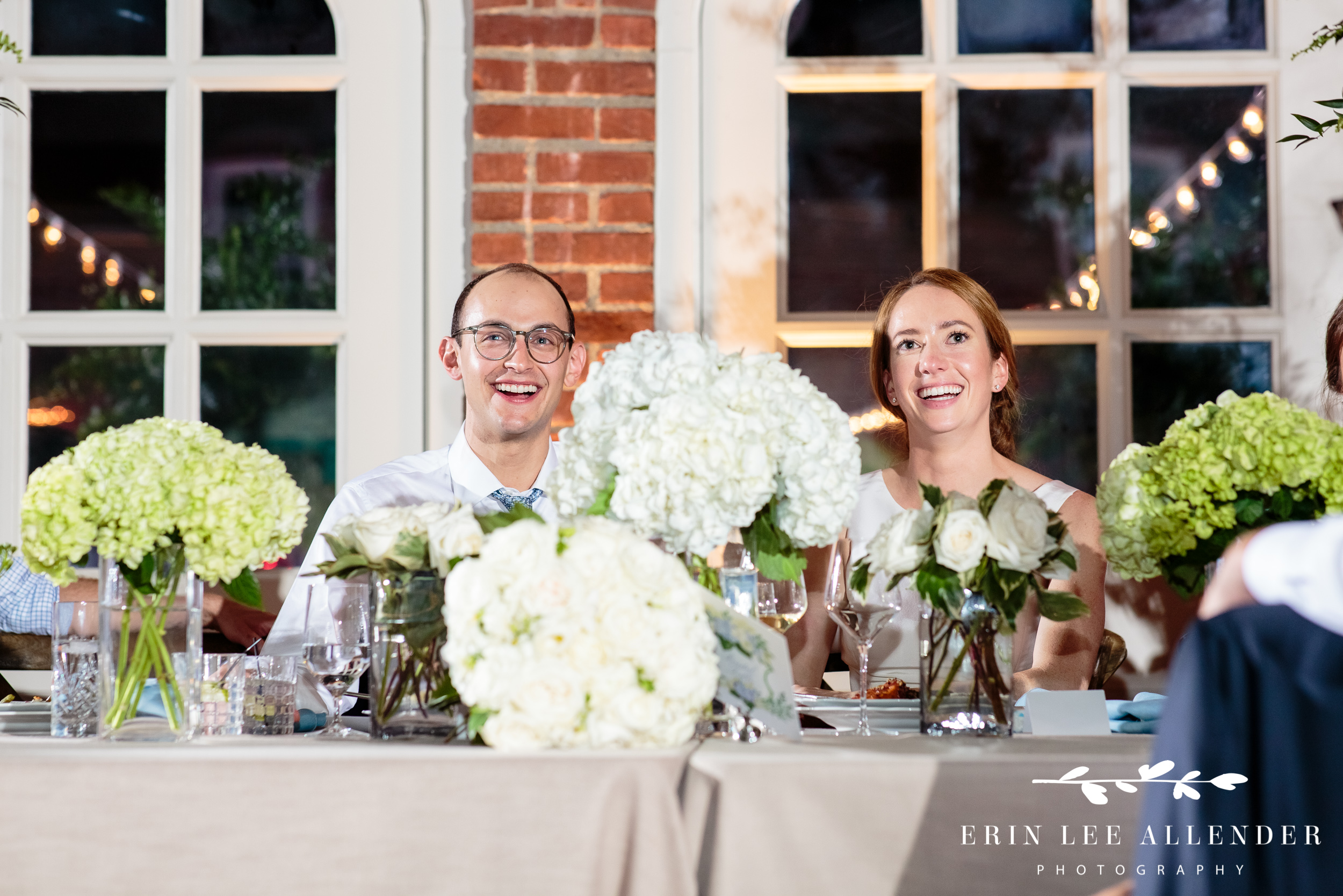 Bride-groom-laughs-toasts