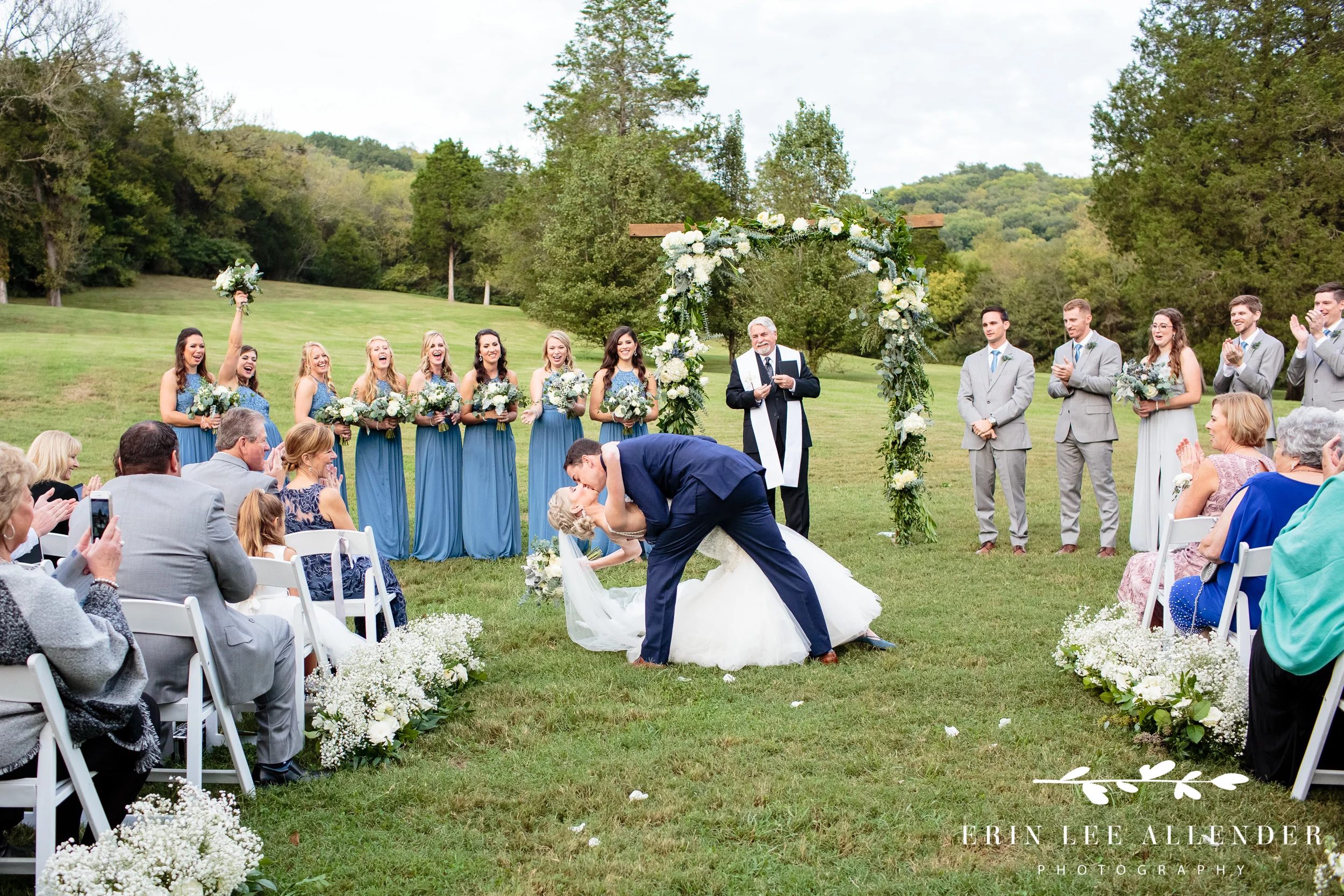 Groom-dips-bride-at-alter