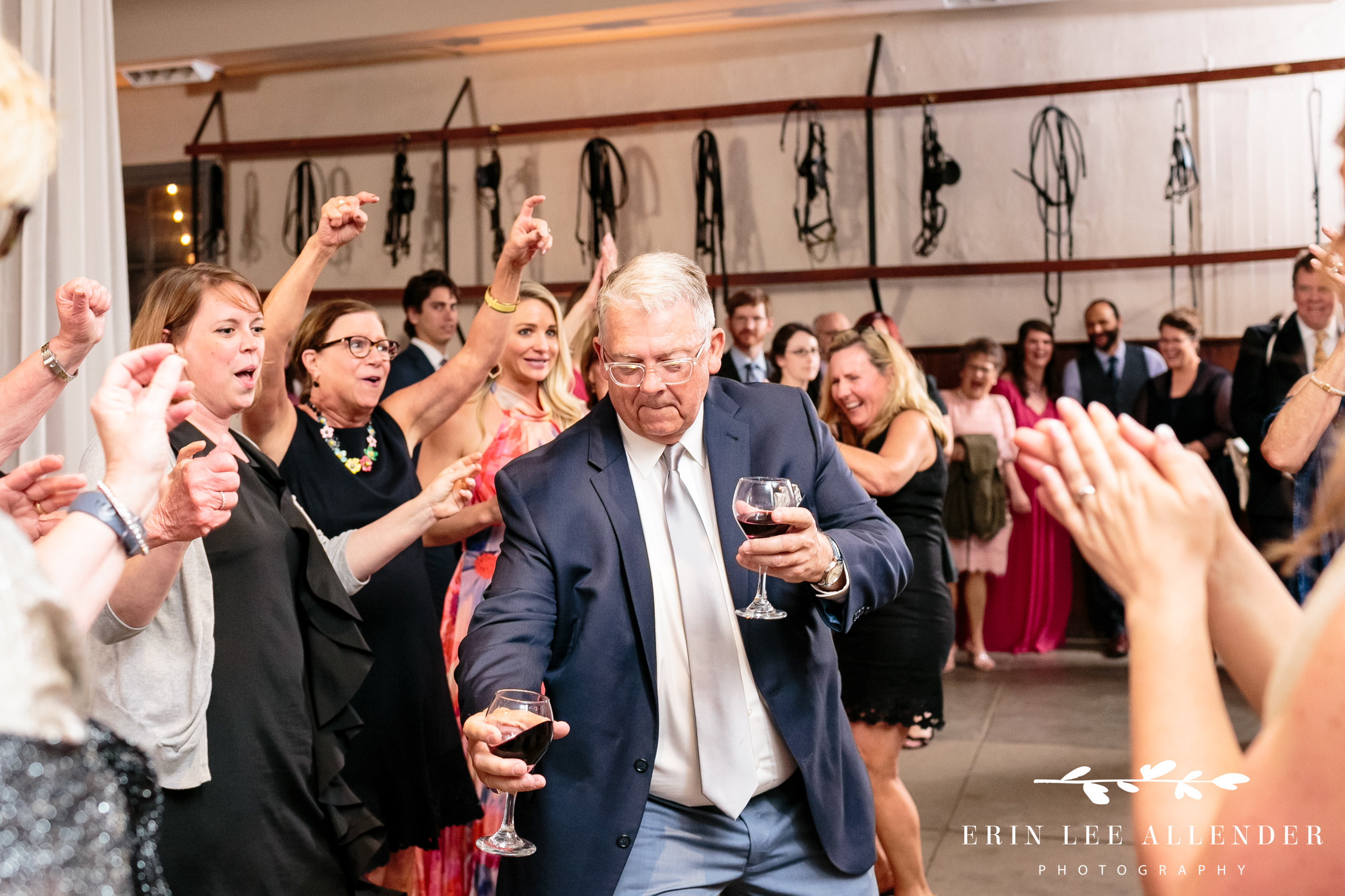 guest-dancing-with-two-wine-glassed