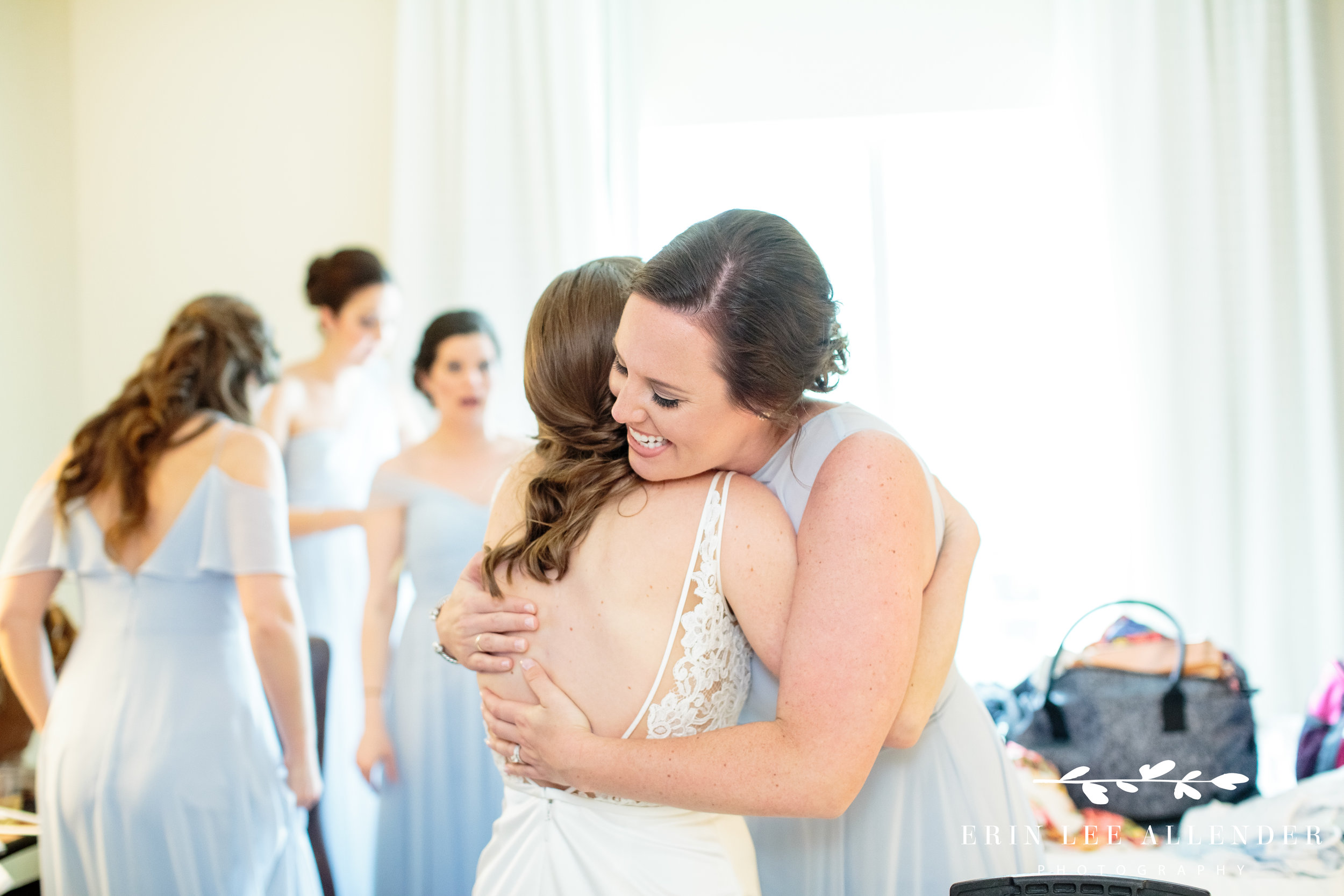 bridesmaid-hugs-bride