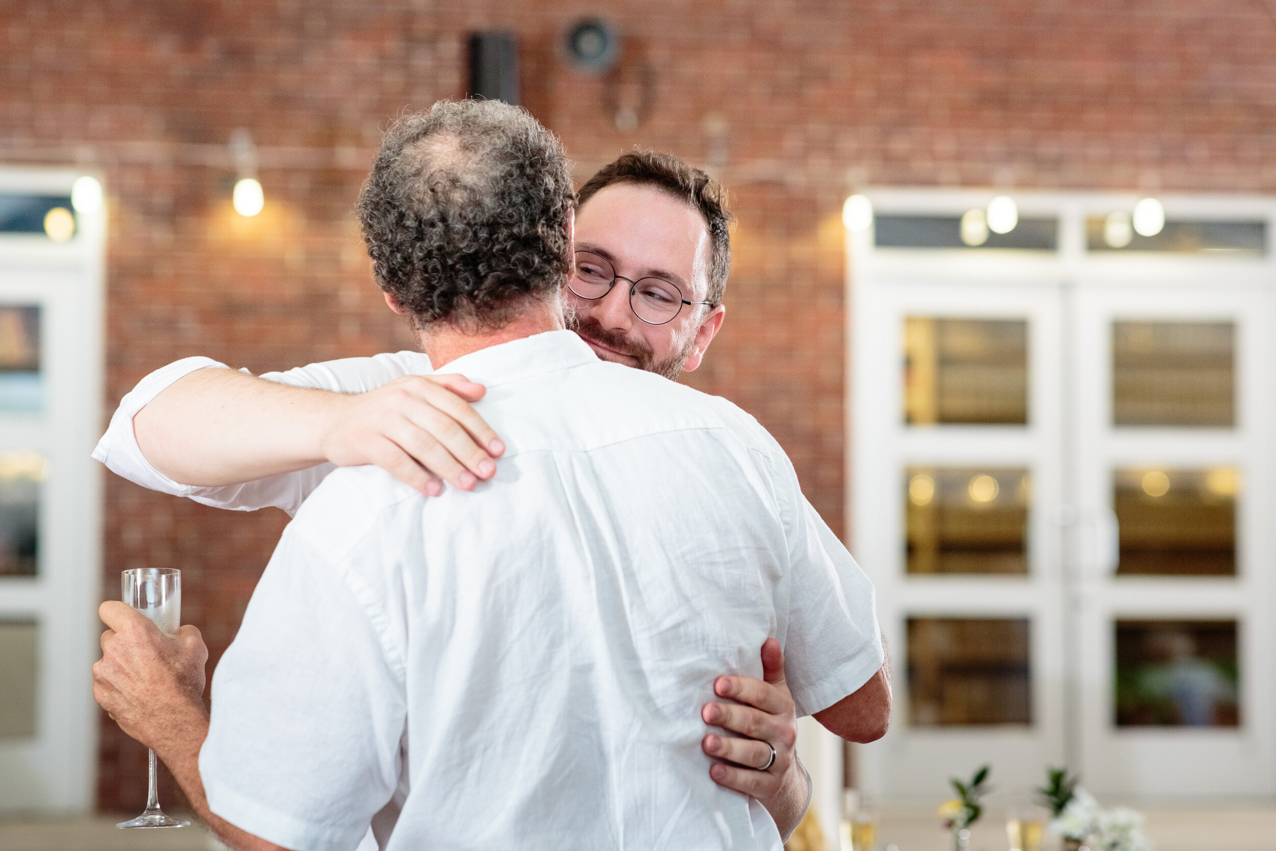 Groom-hugs-dad