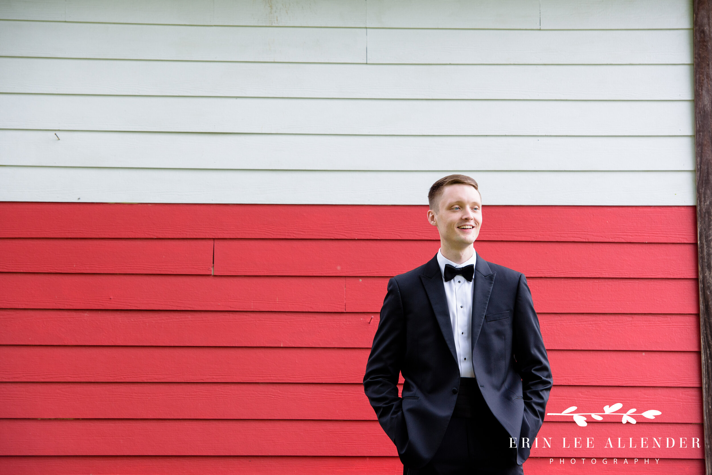Groom-agaisnt-red-wall