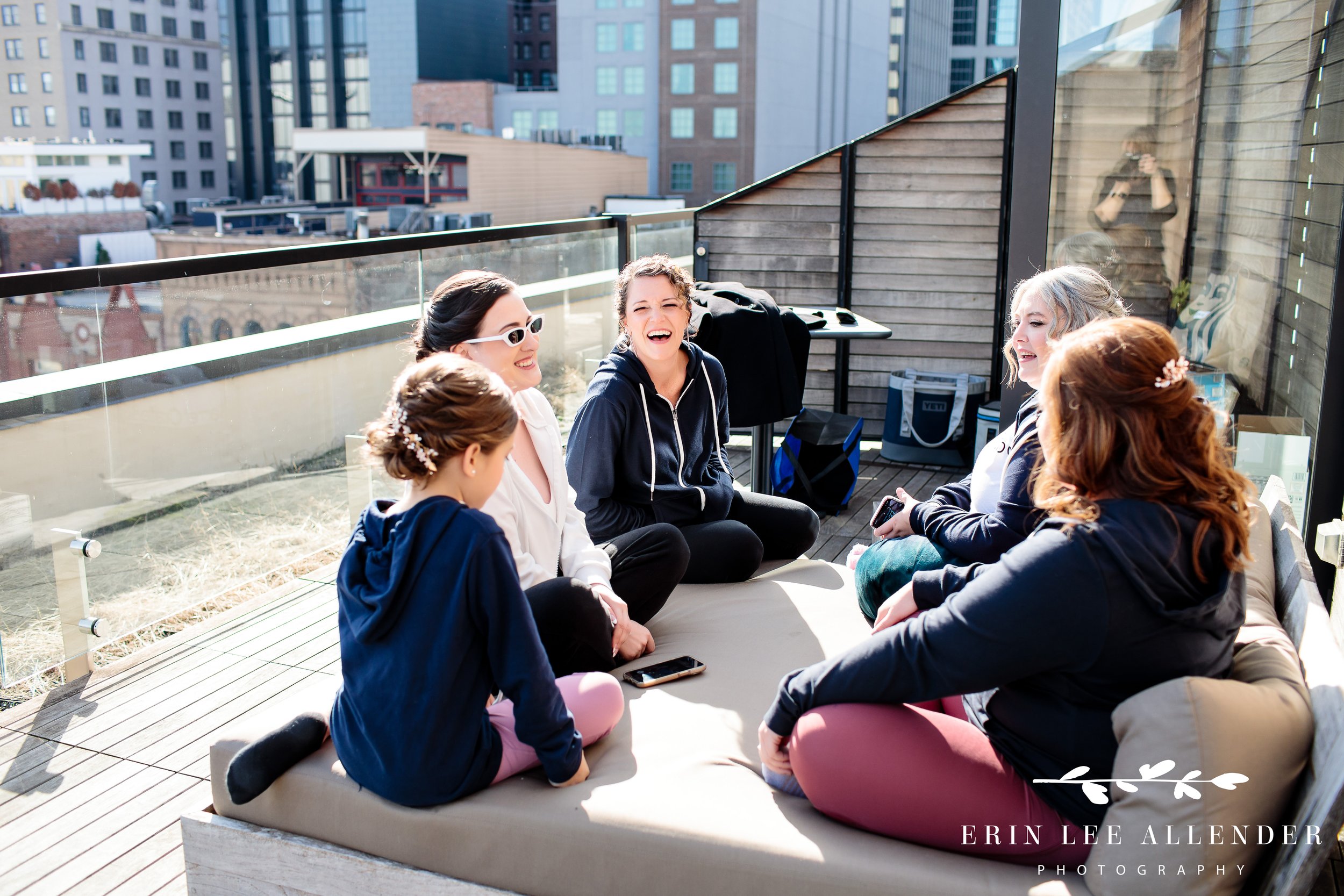 bridesmaids-hanging-out-on-rooftop