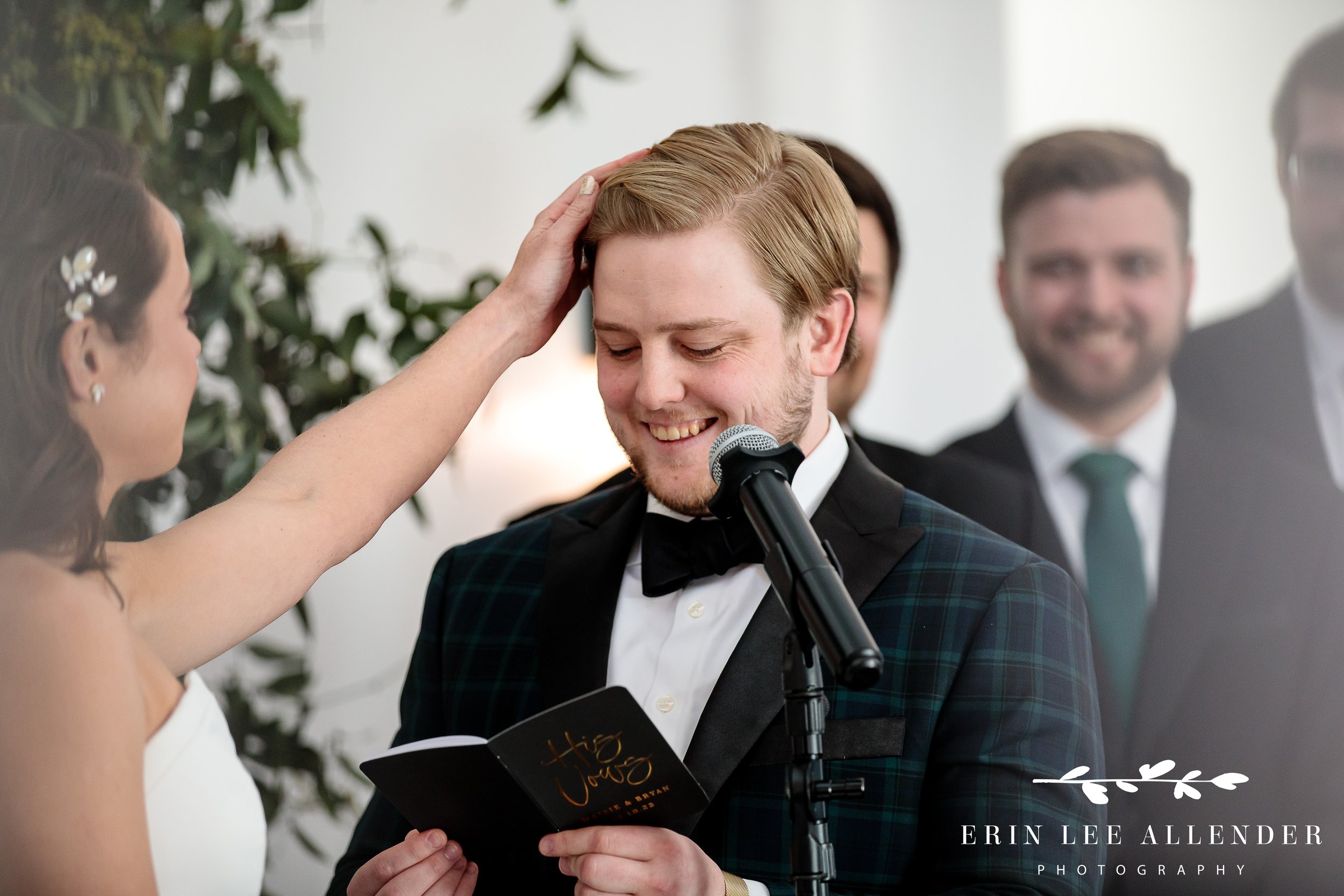 bride-touches-groom-during-vows