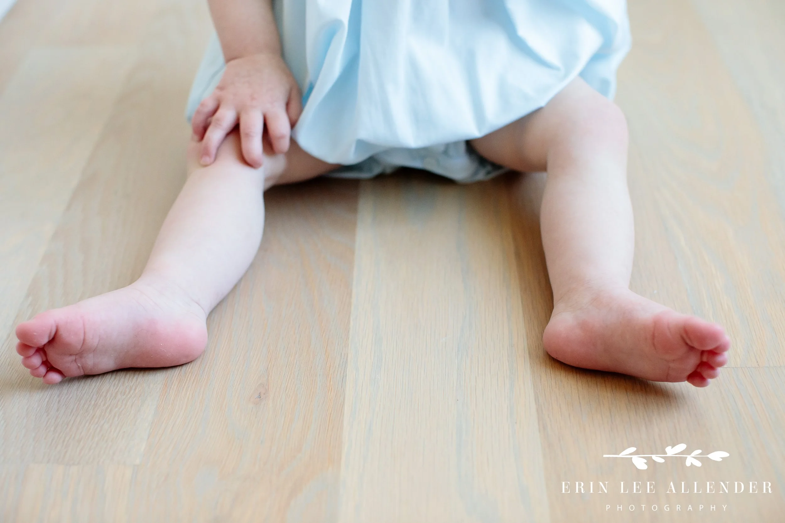 Close-up of baby feet during in-home milestone photography session, Nashville family photography
