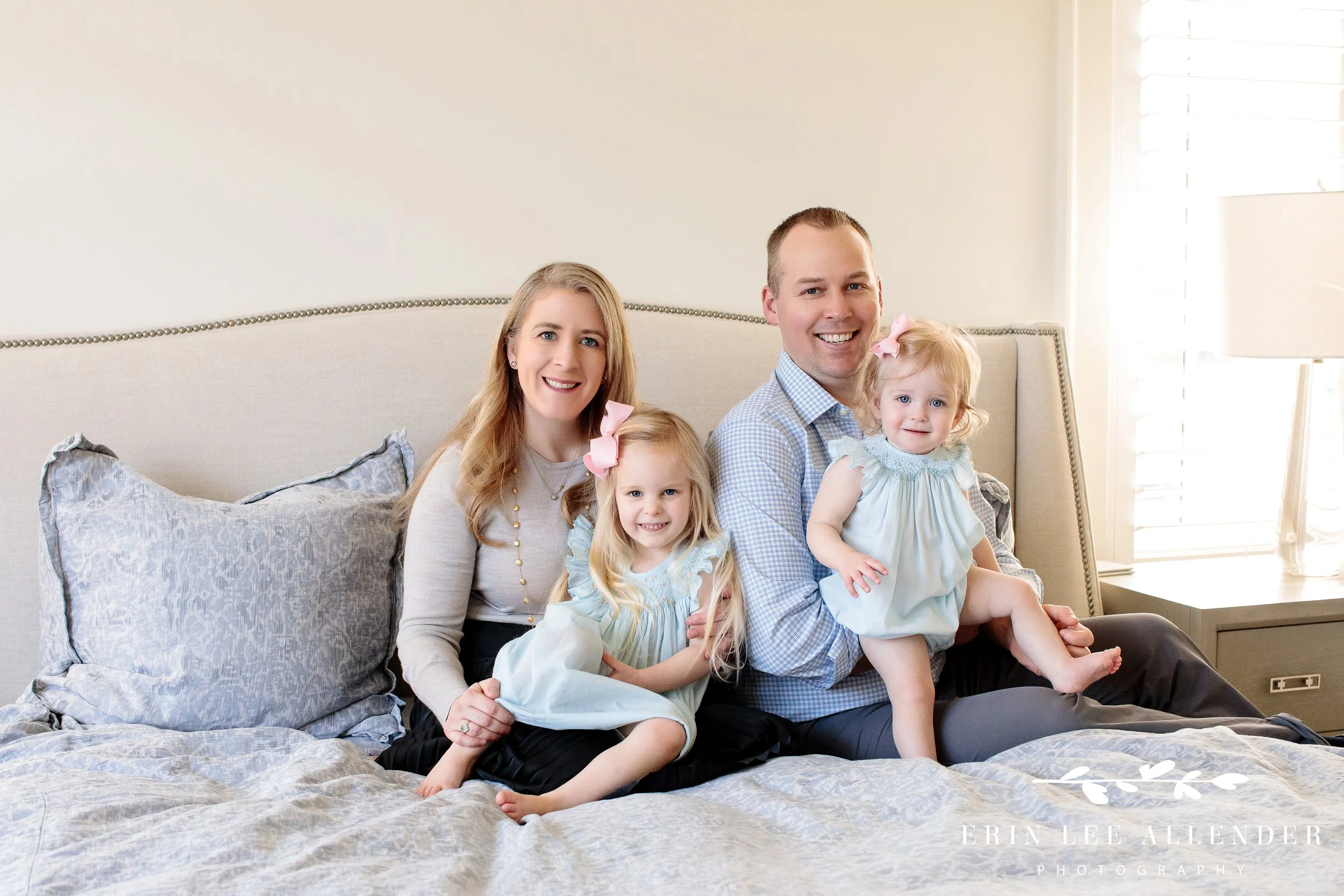 Entire family sitting together on bed during milestone photography session, Nashville family photography