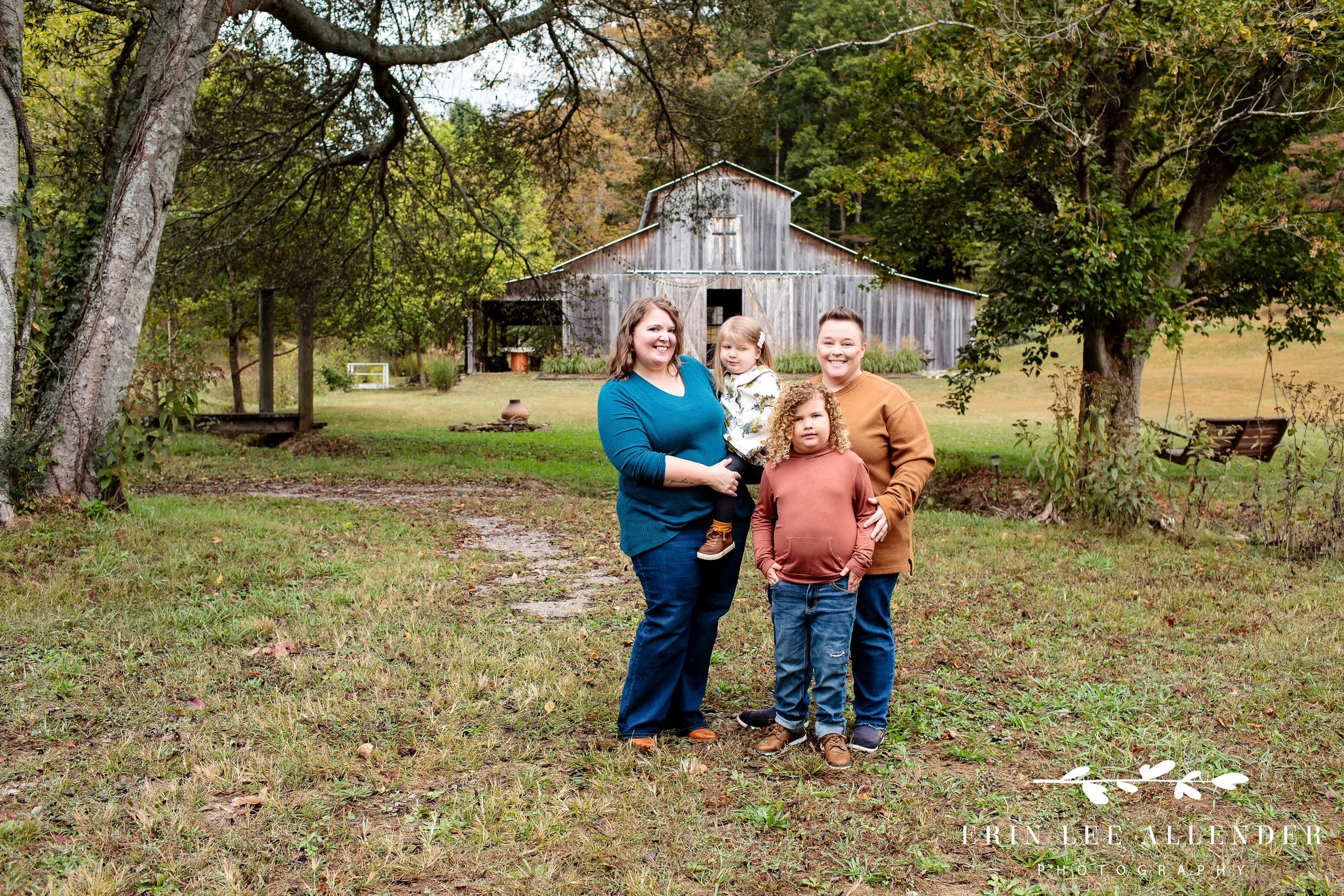 LGBTQ family photography with two moms and children in front of barn Portland Tennessee.
