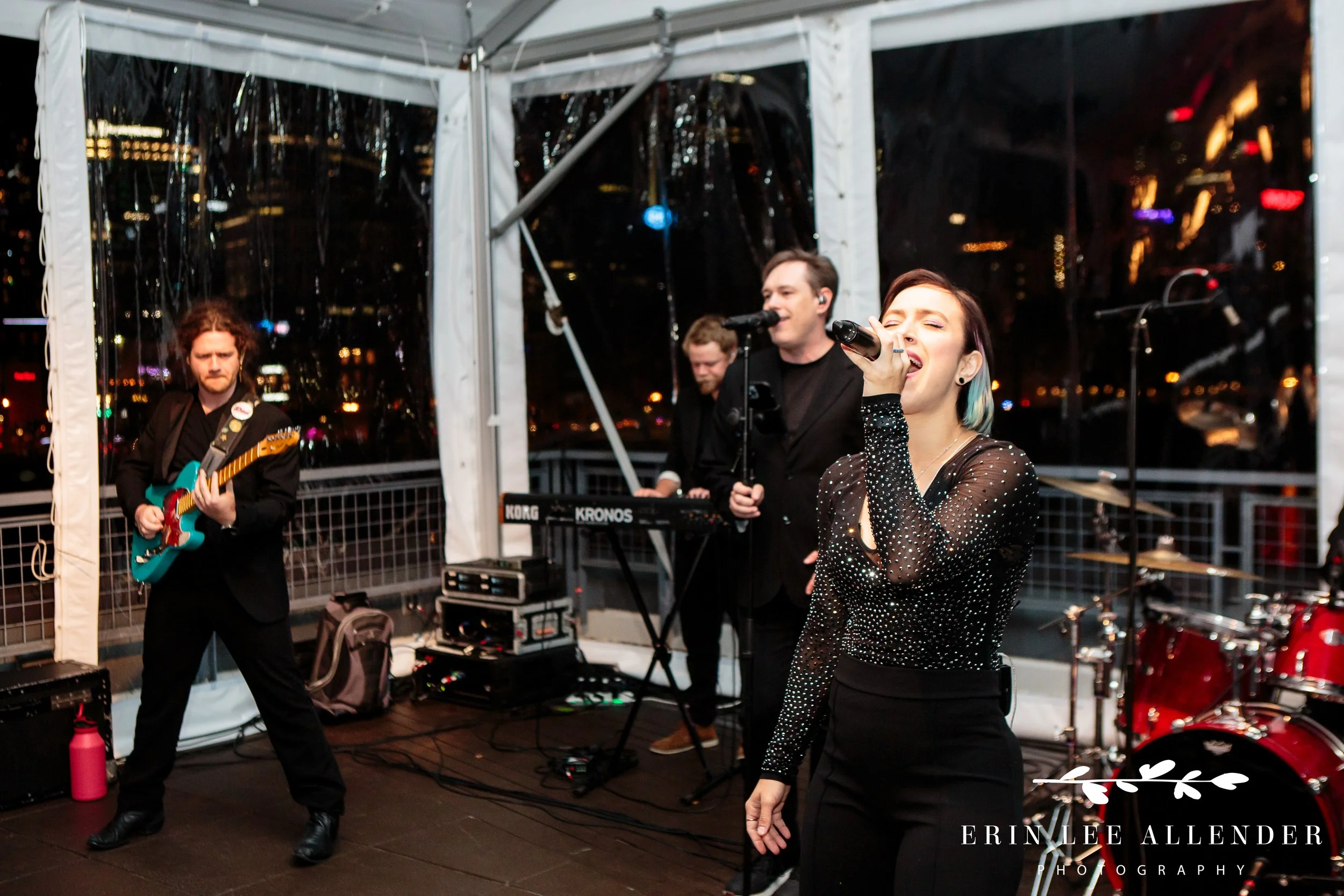 Live band performing at rooftop reception during Bar Mitzvah at The Bridge Building Nashville.