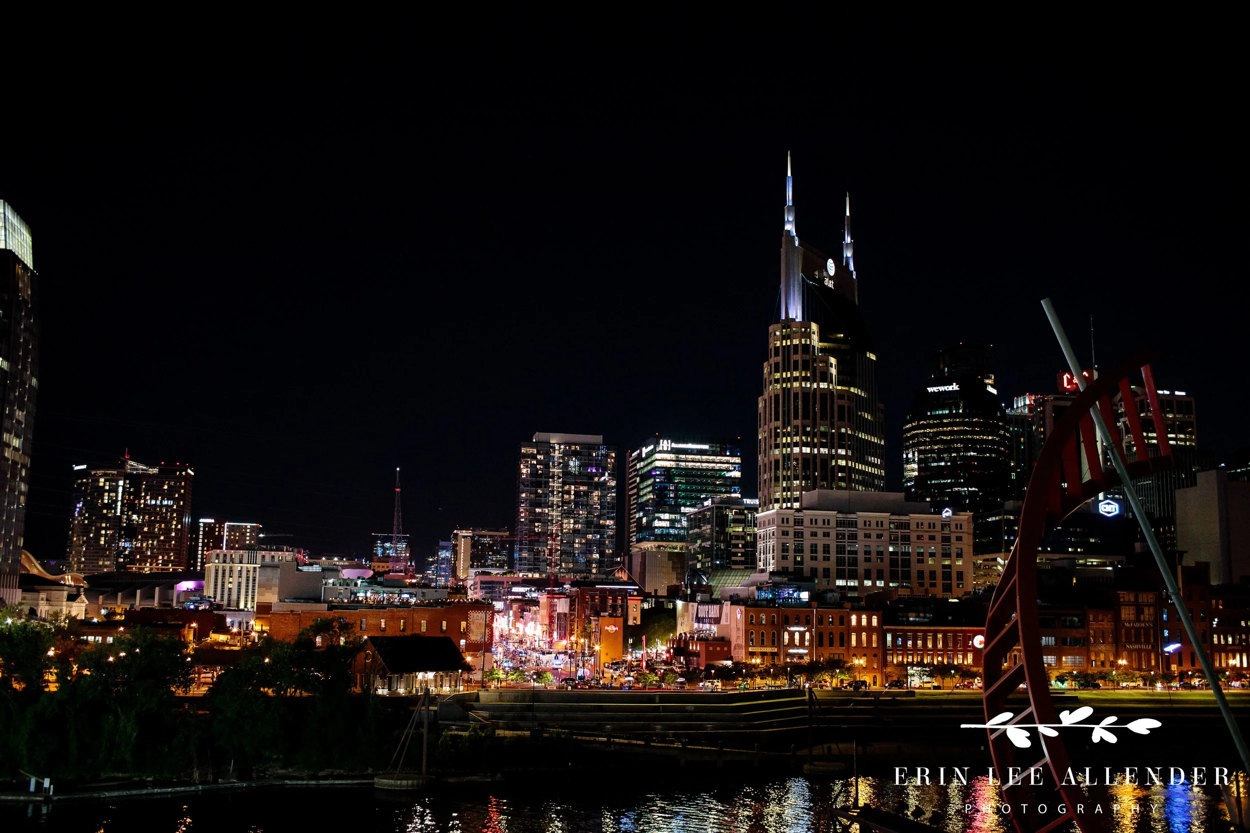 Night view of Nashville city skyline during rooftop Bar Mitzvah celebration.