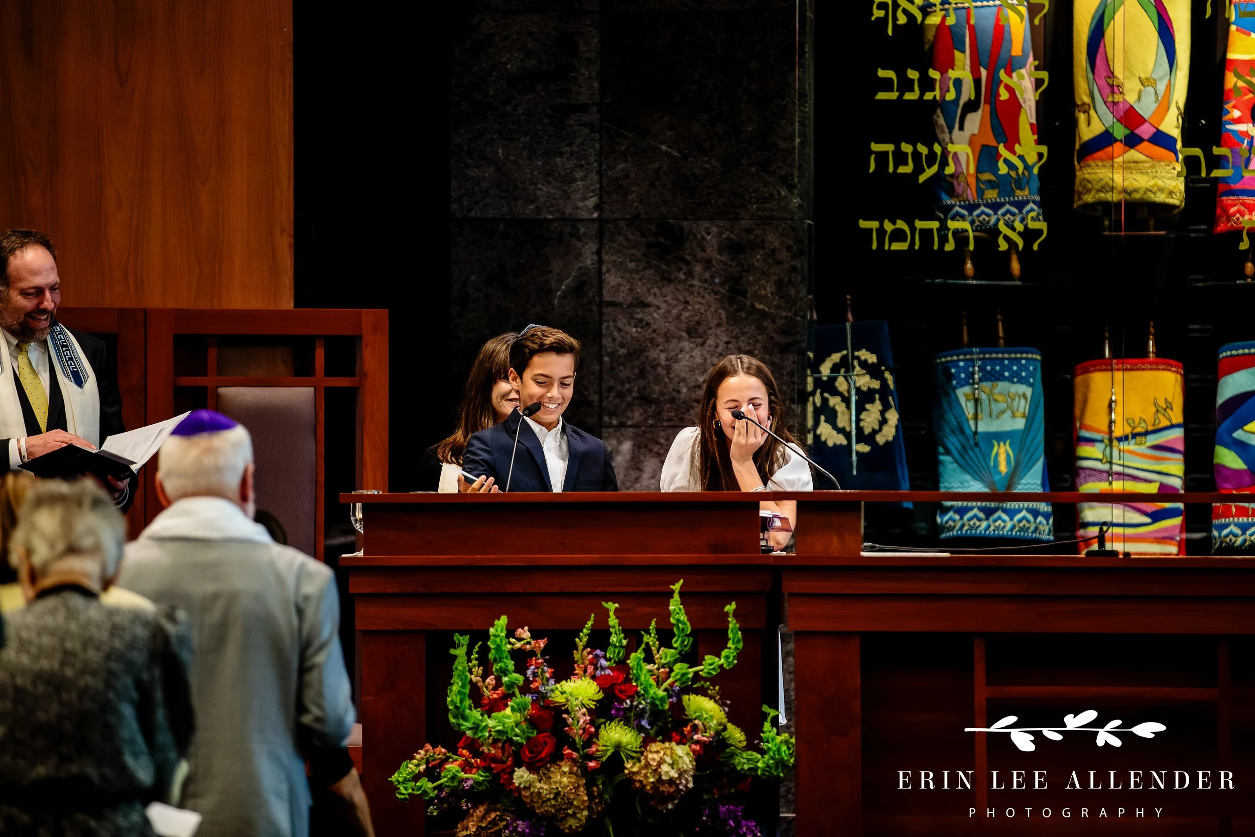 Parents hugging children during b’nai mitzvah ceremony at The Temple Nashville