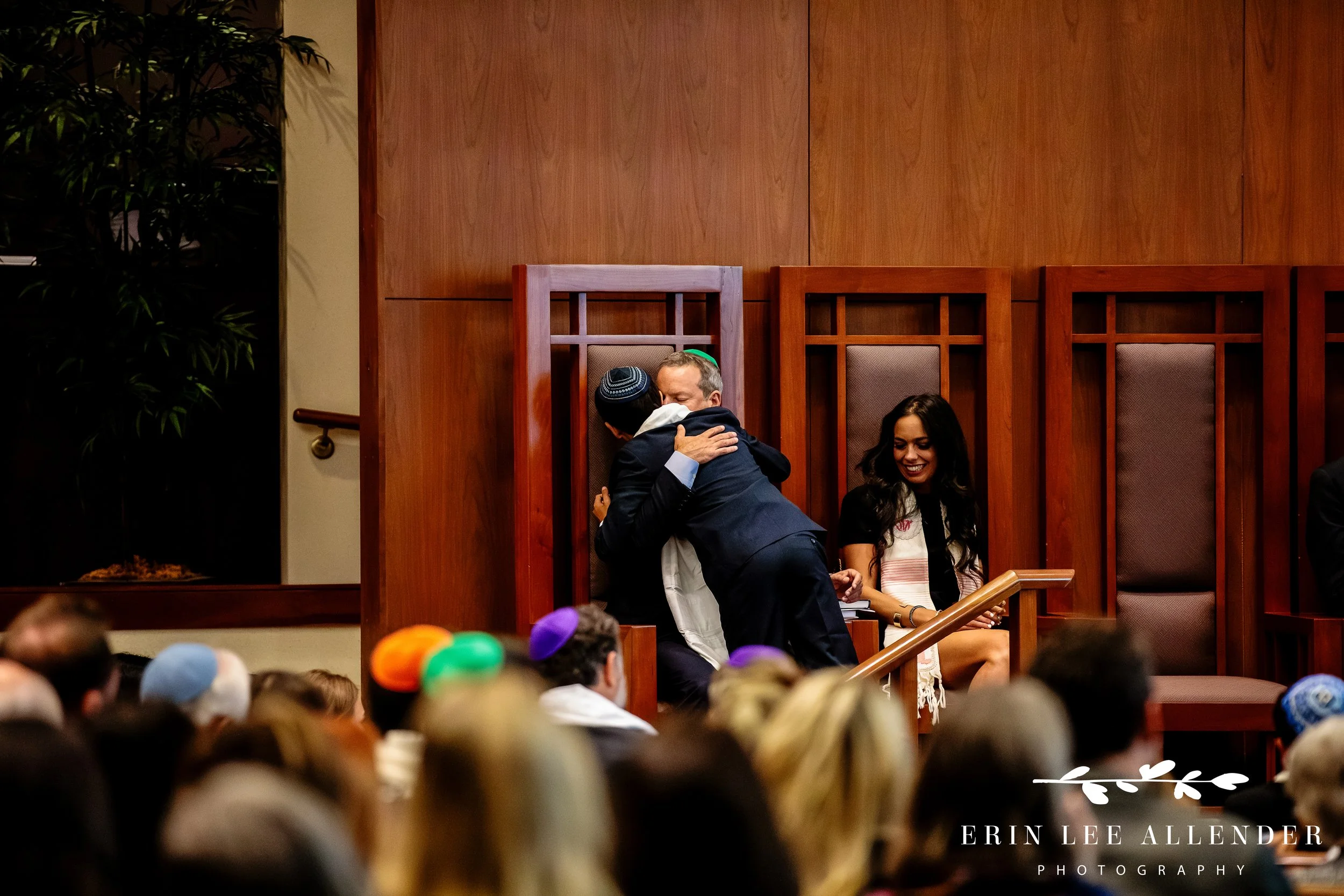 Parents hugging children during b’nai mitzvah ceremony at The Temple Nashville