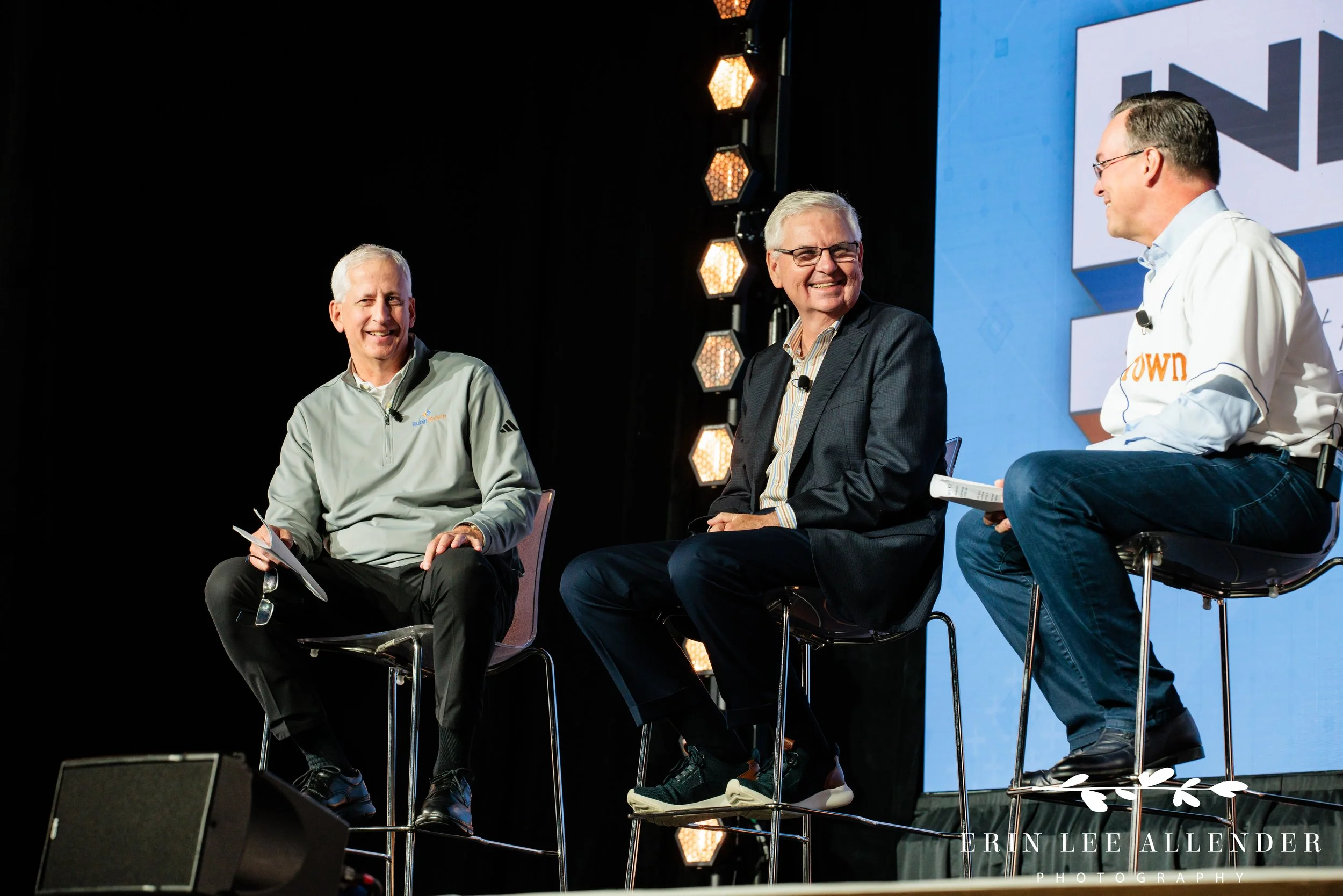 Nashville conference photographer capturing a fireside chat with Barry Melancon and laughter on stage at RubinBrown's conference at Gaylord Opryland Resort