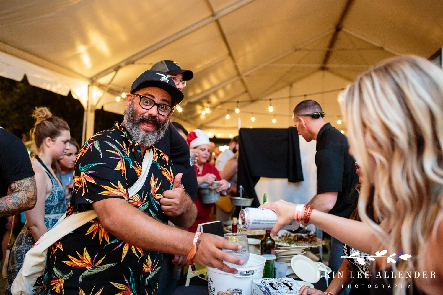 Festival guest giving a thumbs up while receiving food samples at the Music City Food and Wine Festival Nashville Tennessee