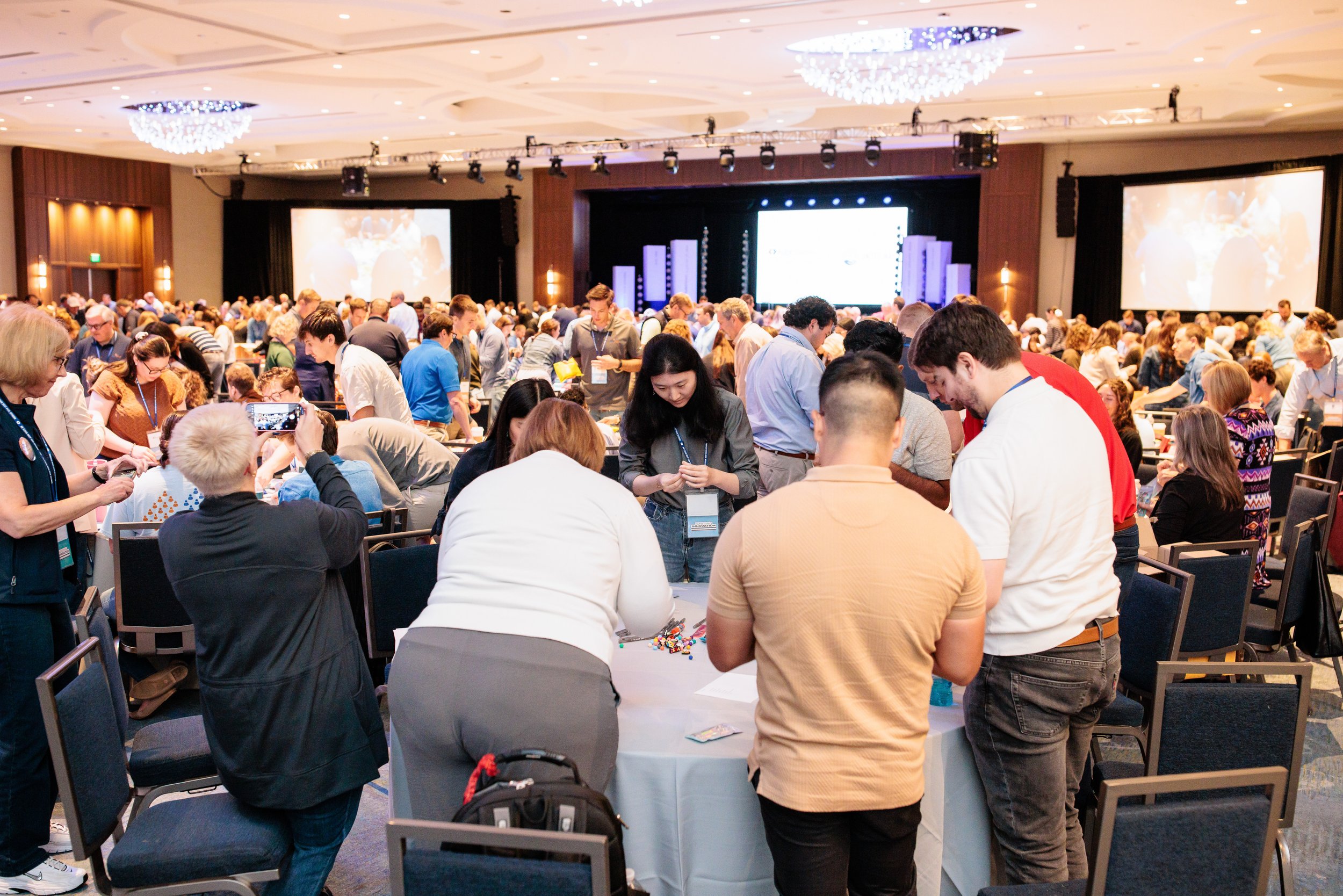 Opryland Hotel conference photography of a wide room shot showing all the tables during RubinBrown's Hands On service project