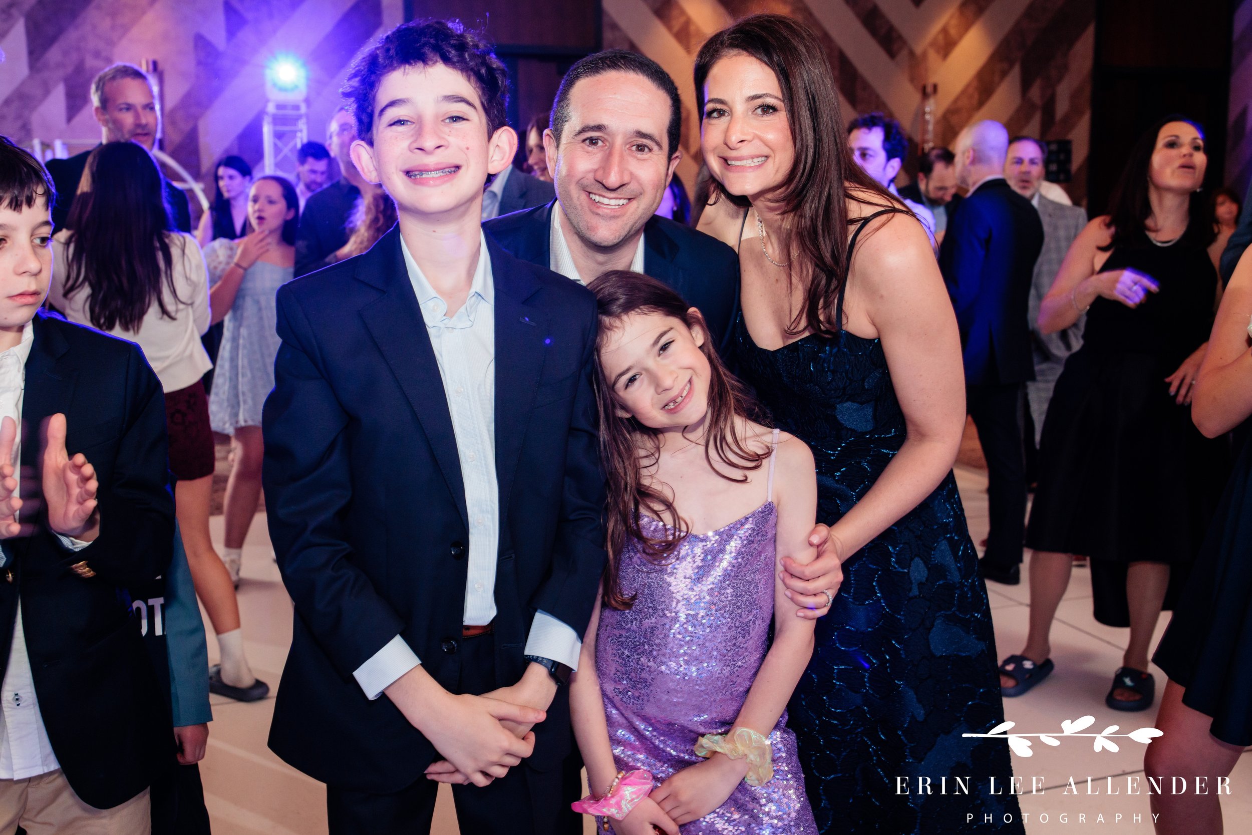 Group photo with family and LED screen at W Nashville bar mitzvah reception