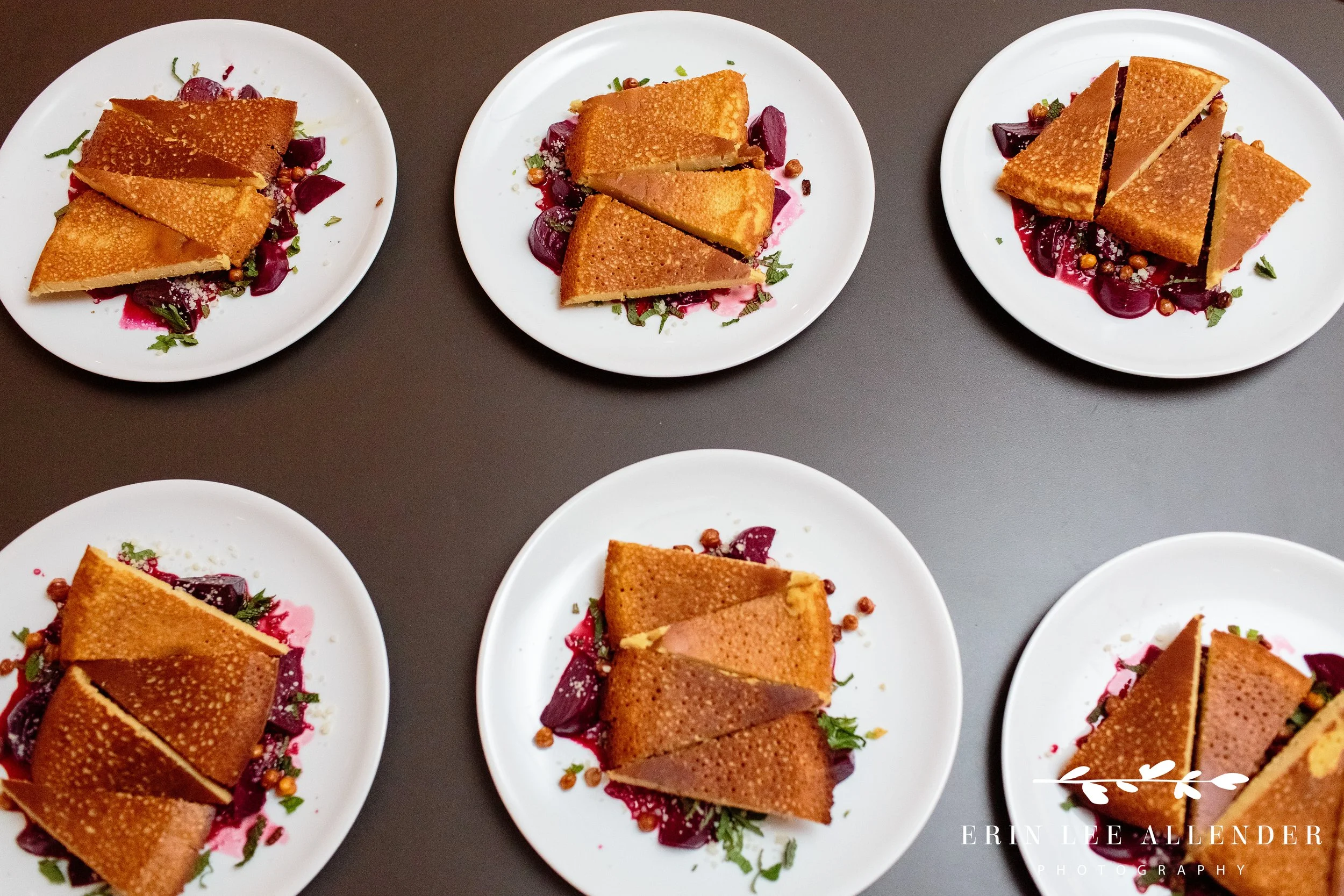 Multiple plated dishes ready for service at No Kid Hungry dinner Nashville
