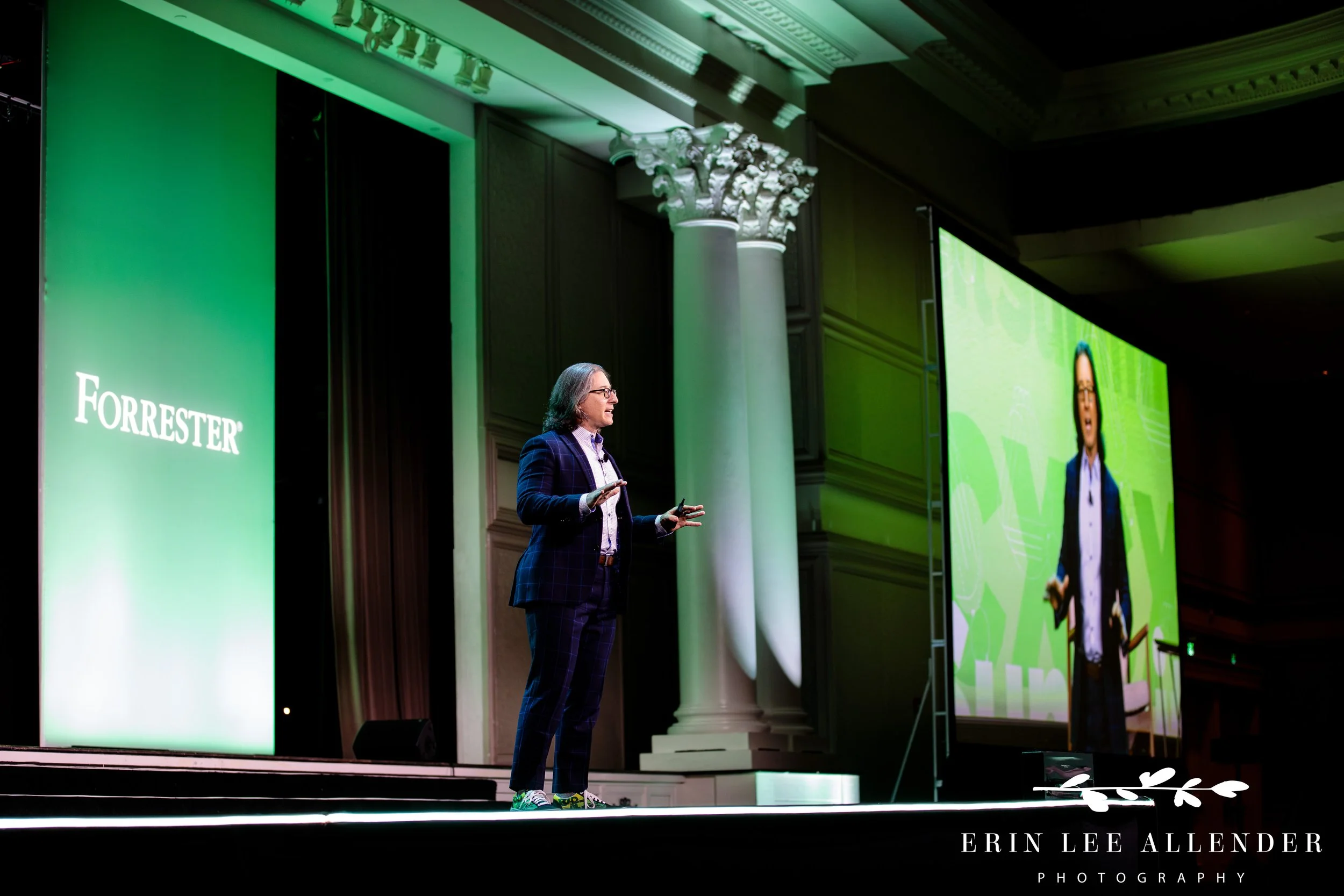keynote speaker addressing large audience during corporate conference at opryland hotel