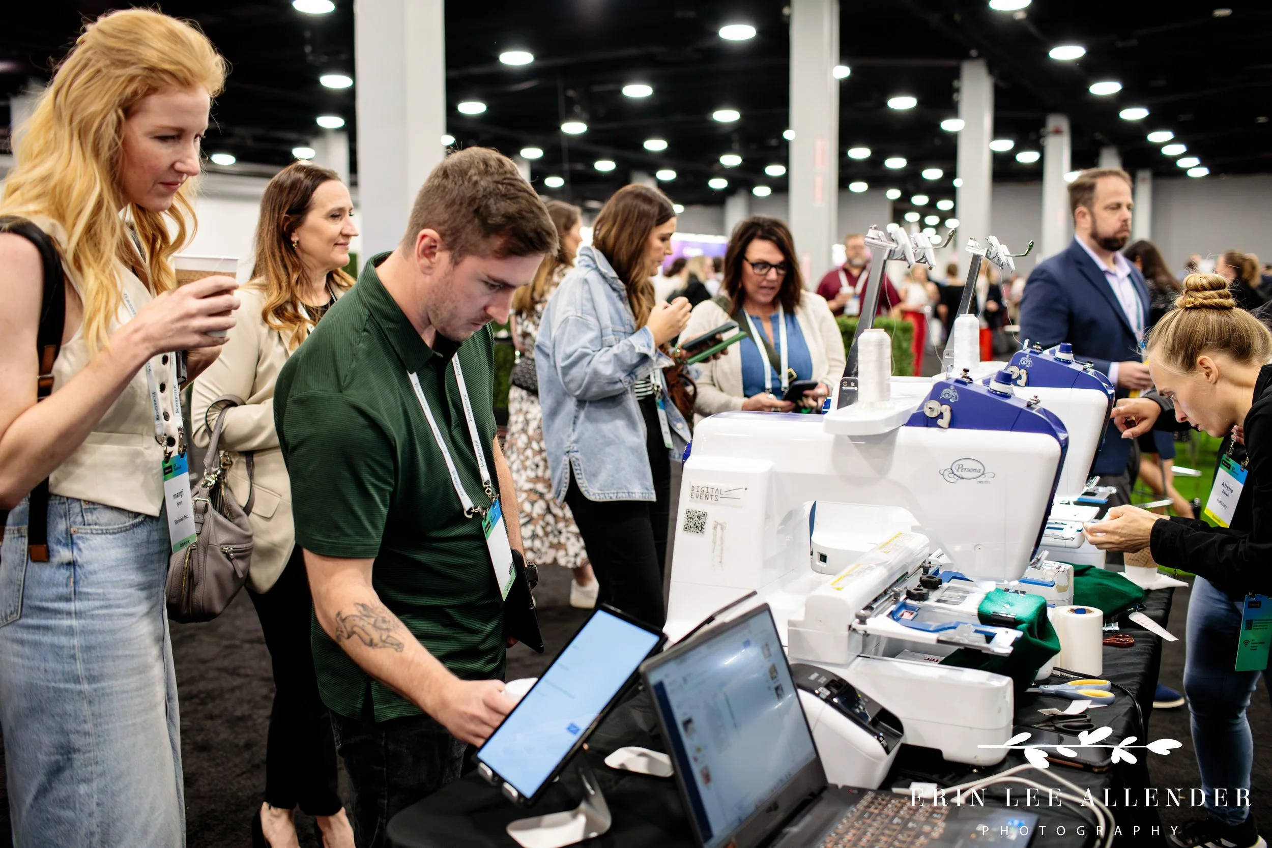 Vendor interacting with attendees in the expo hall at corporate CX conference Gaylord Opryland Hotel