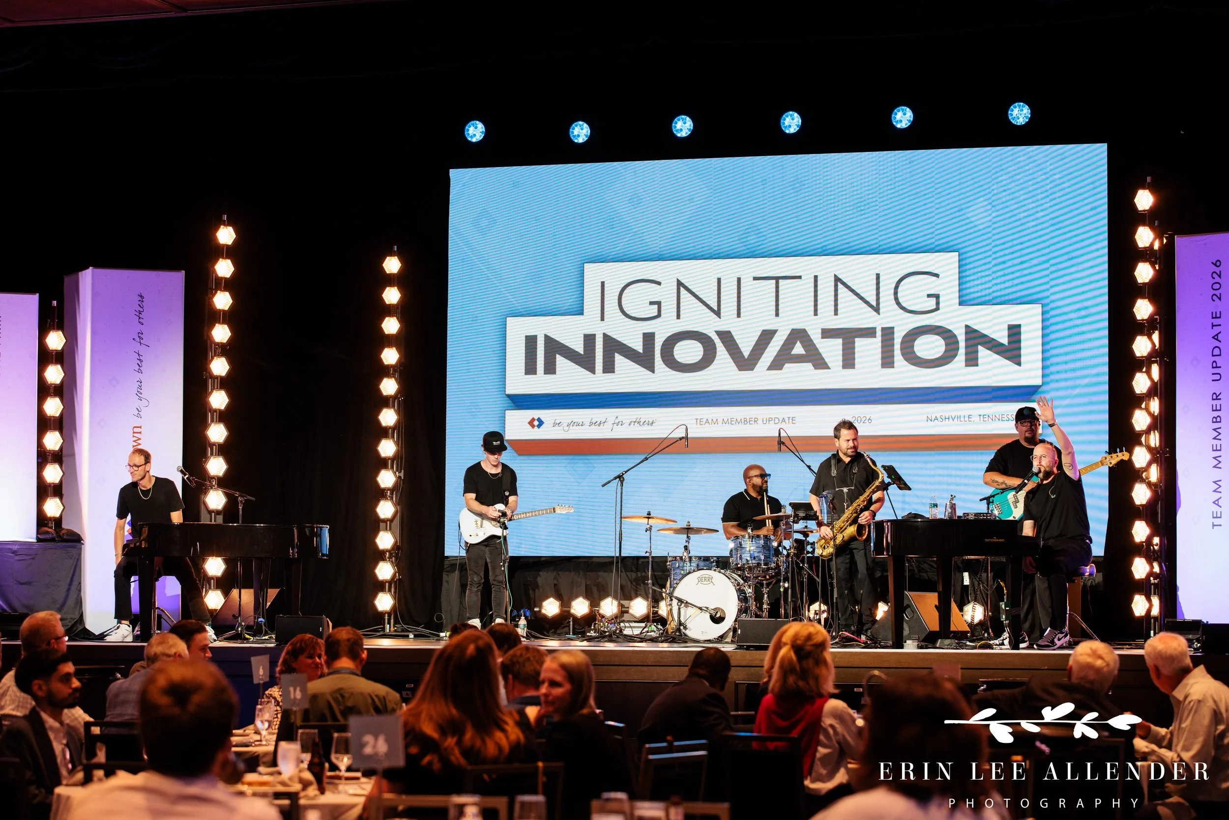 Nashville corporate event photography of Music City Dueling Pianos taking the stage as entertainment at RubinBrown's awards dinner at Gaylord Opryland Resort