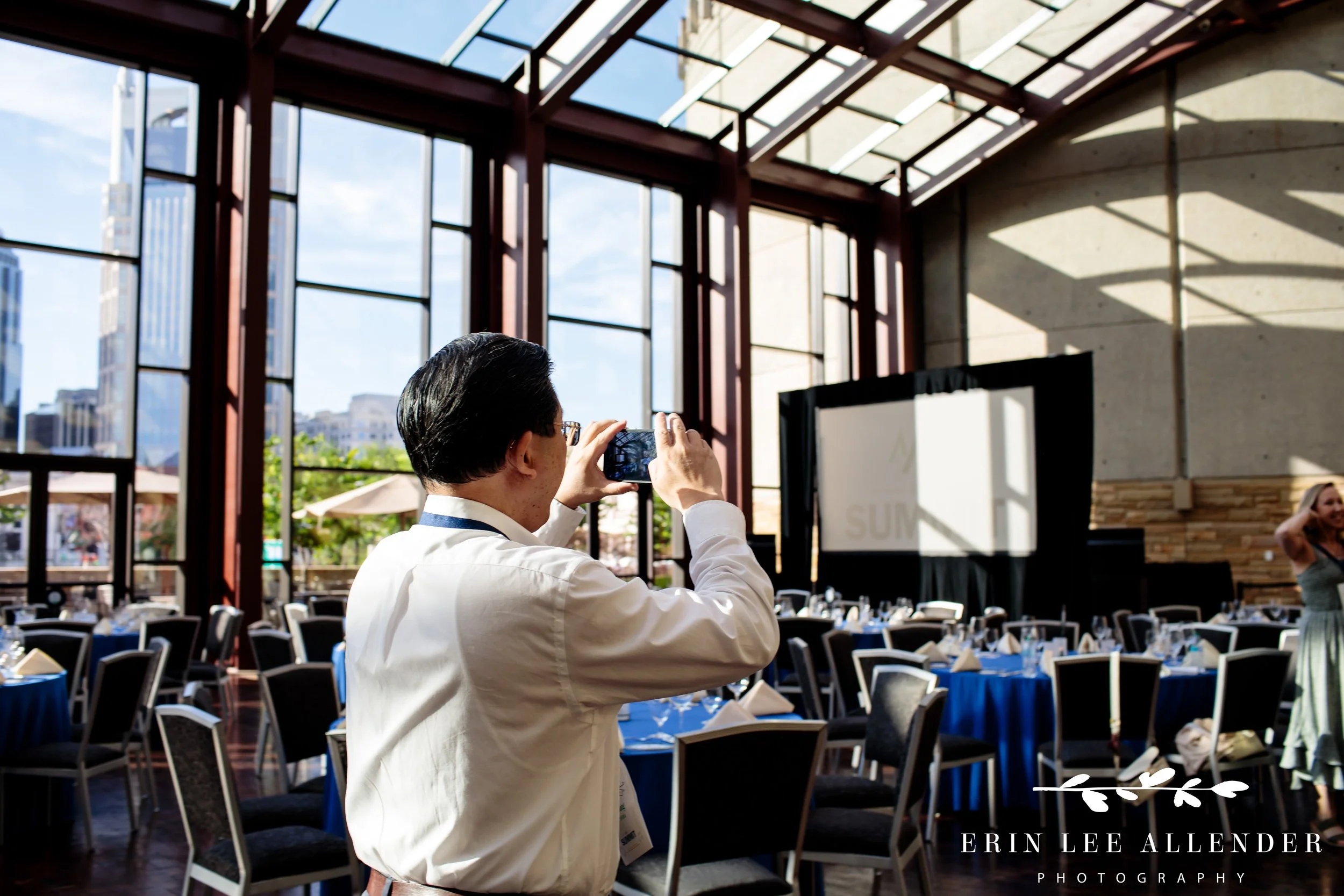 Nashville conference photographer — guest taking a photo of the room during CBIZ Nashville Summit closing party at Country Music Hall of Fame