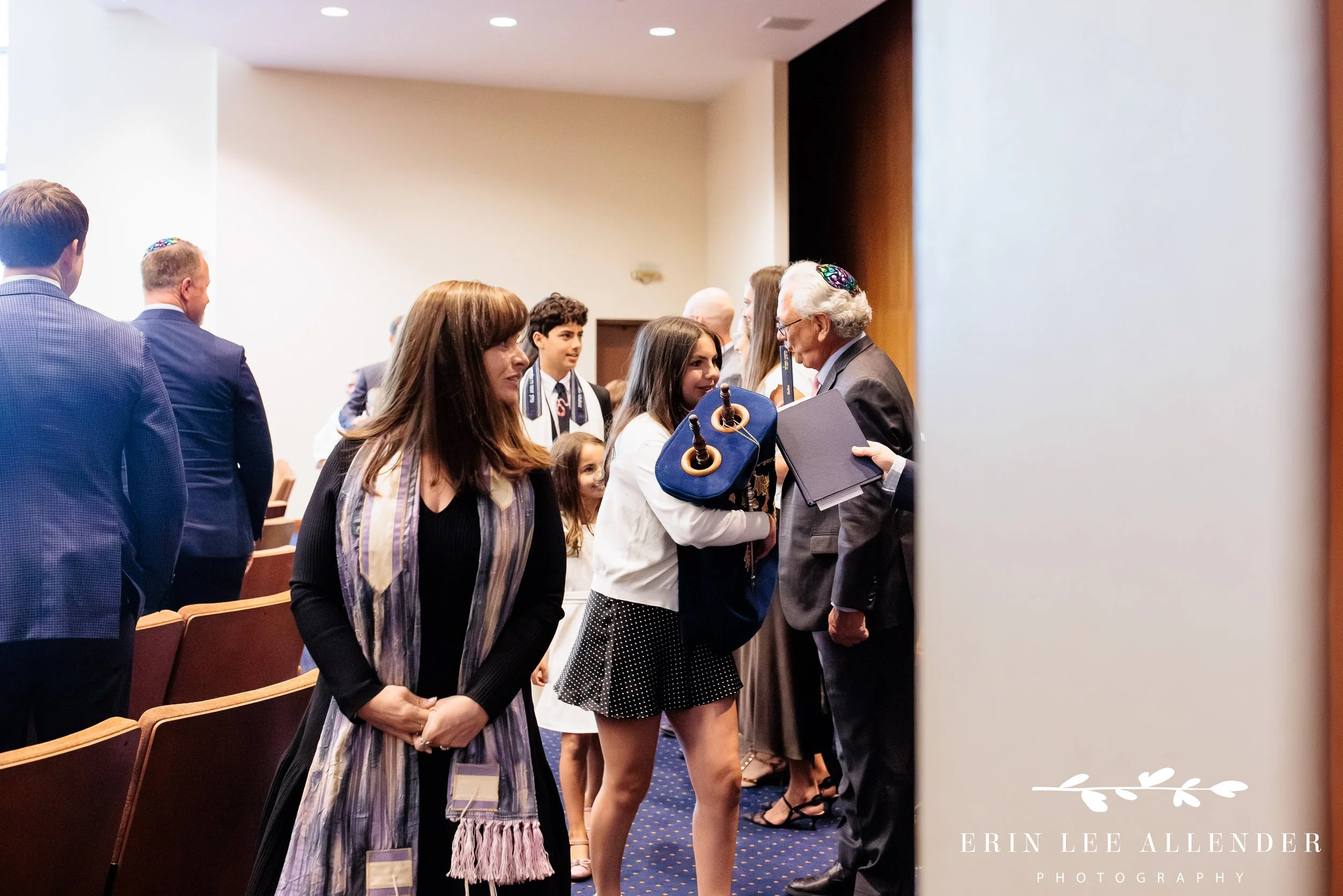 Torah processional moving through temple