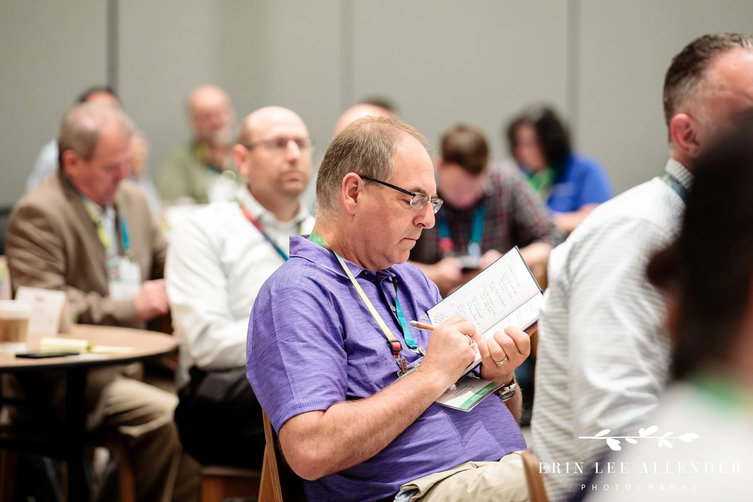 Close-up of an attendee engaged during a corporate conference