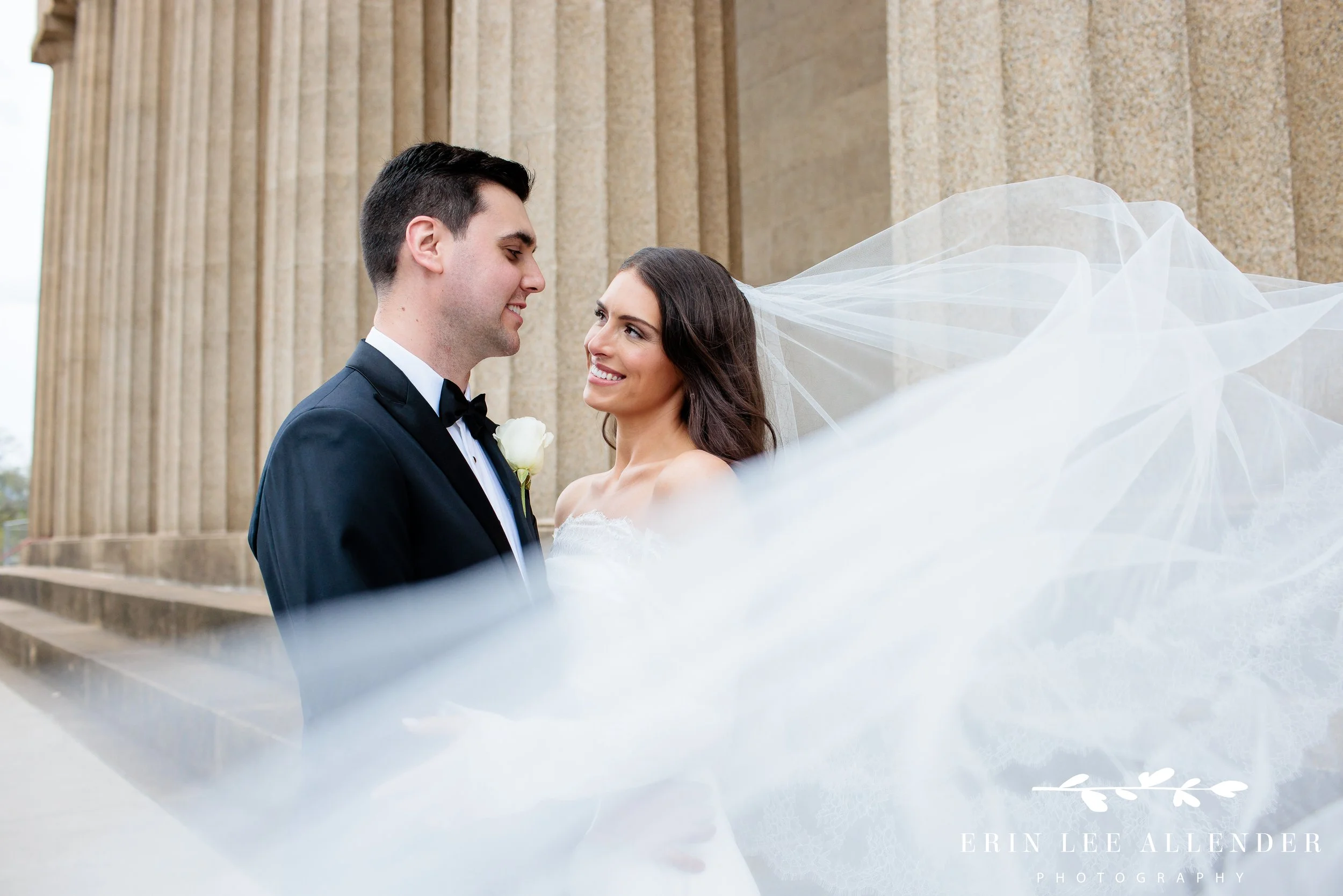Nashville wedding portraits — bride's veil caught in the wind at the Parthenon in Centennial Park