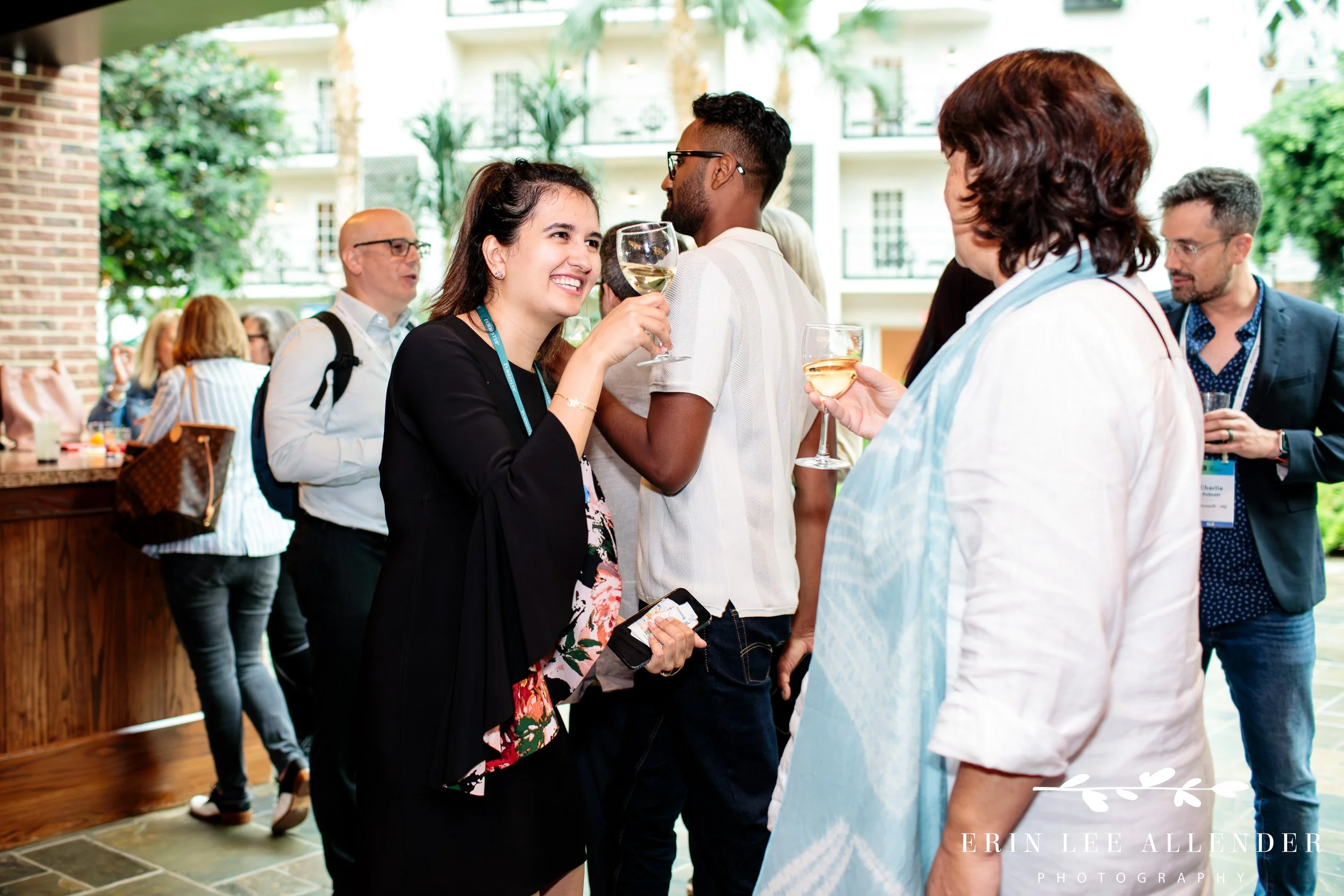 Small group of attendees cheersing during conference event at Opryland Hotel