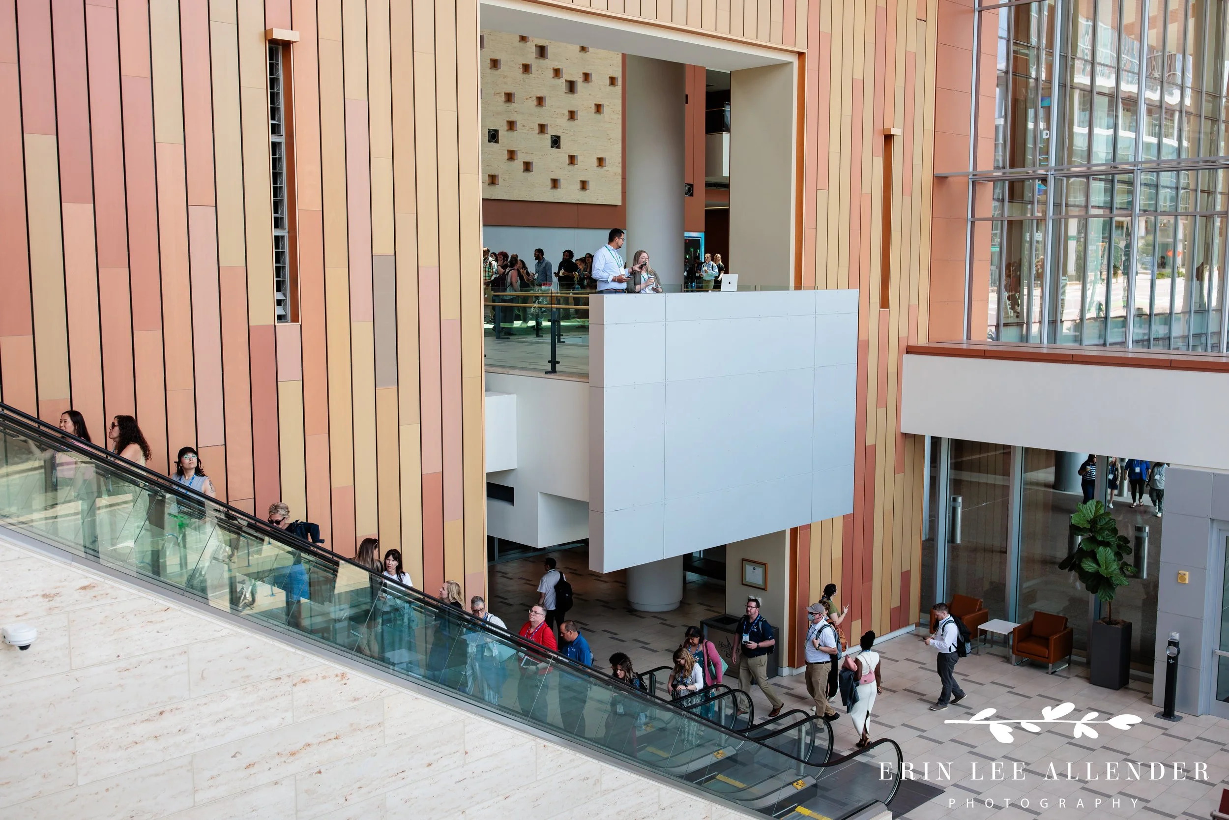 Nashville conference photography — wide shot of Post Captain's podcast recording with attendees passing by at the Slate Summit