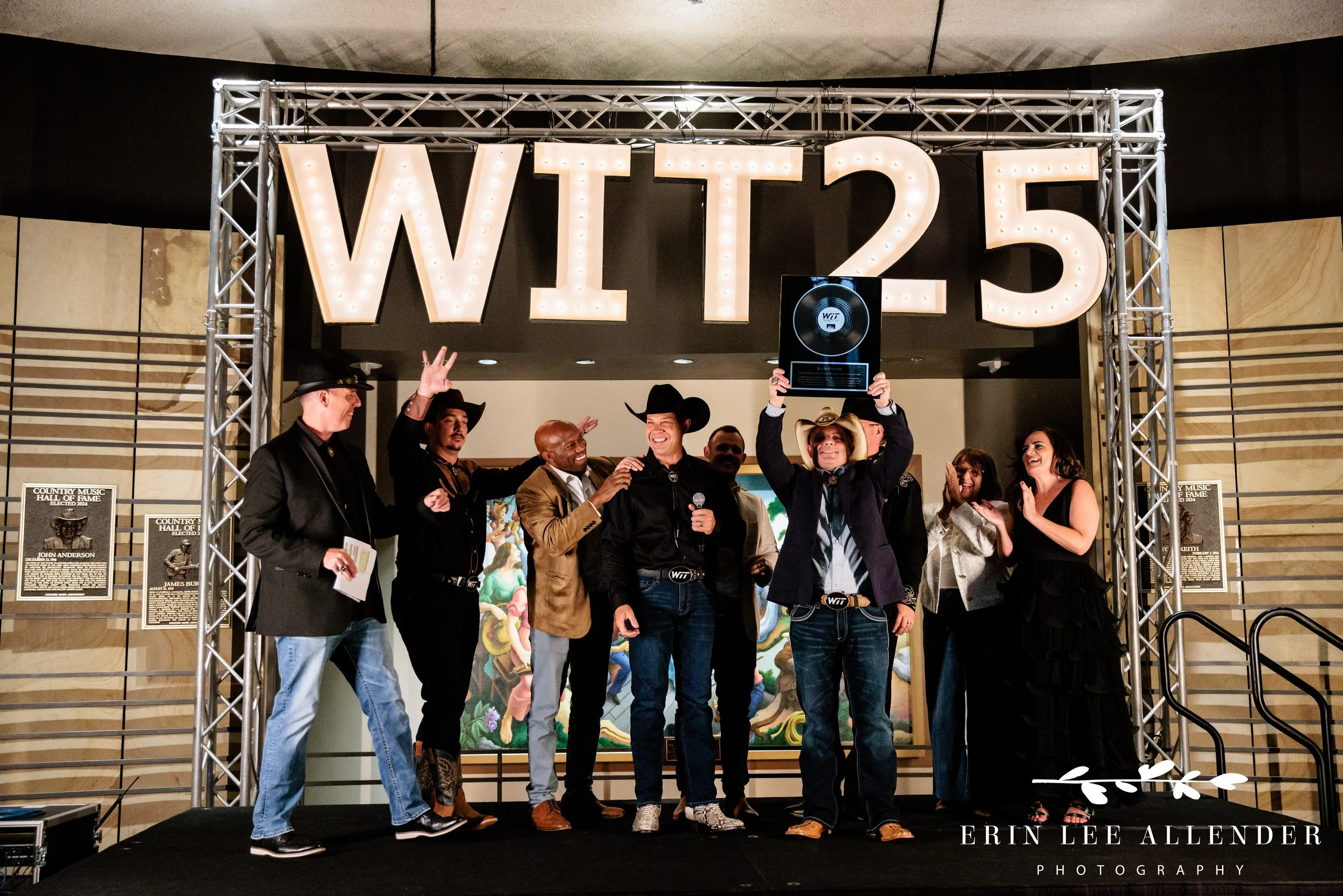 award recipient being congratulated at award show at country music hall of fame