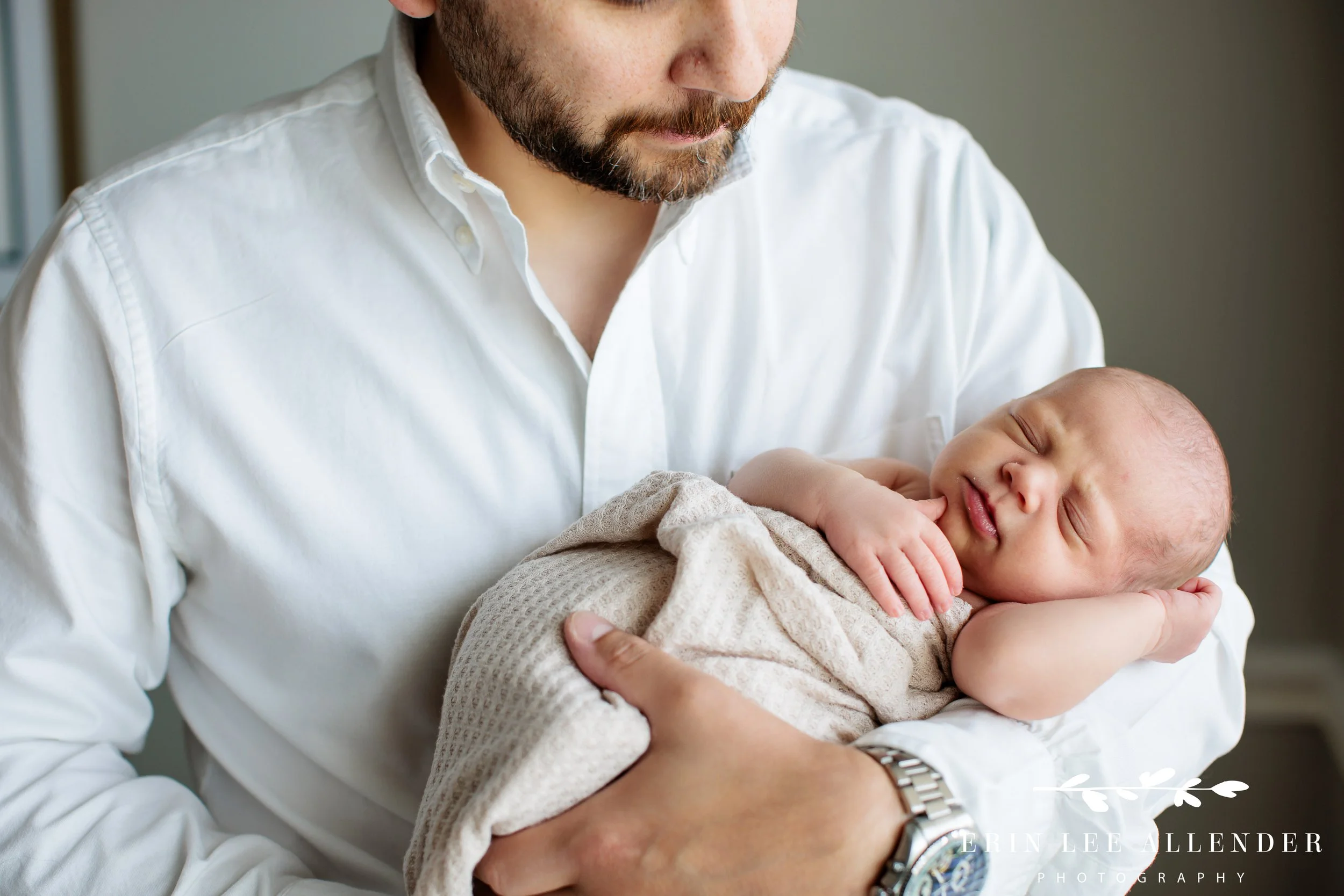 Nashville newborn photography — father holding his newborn baby girl during in-home lifestyle session