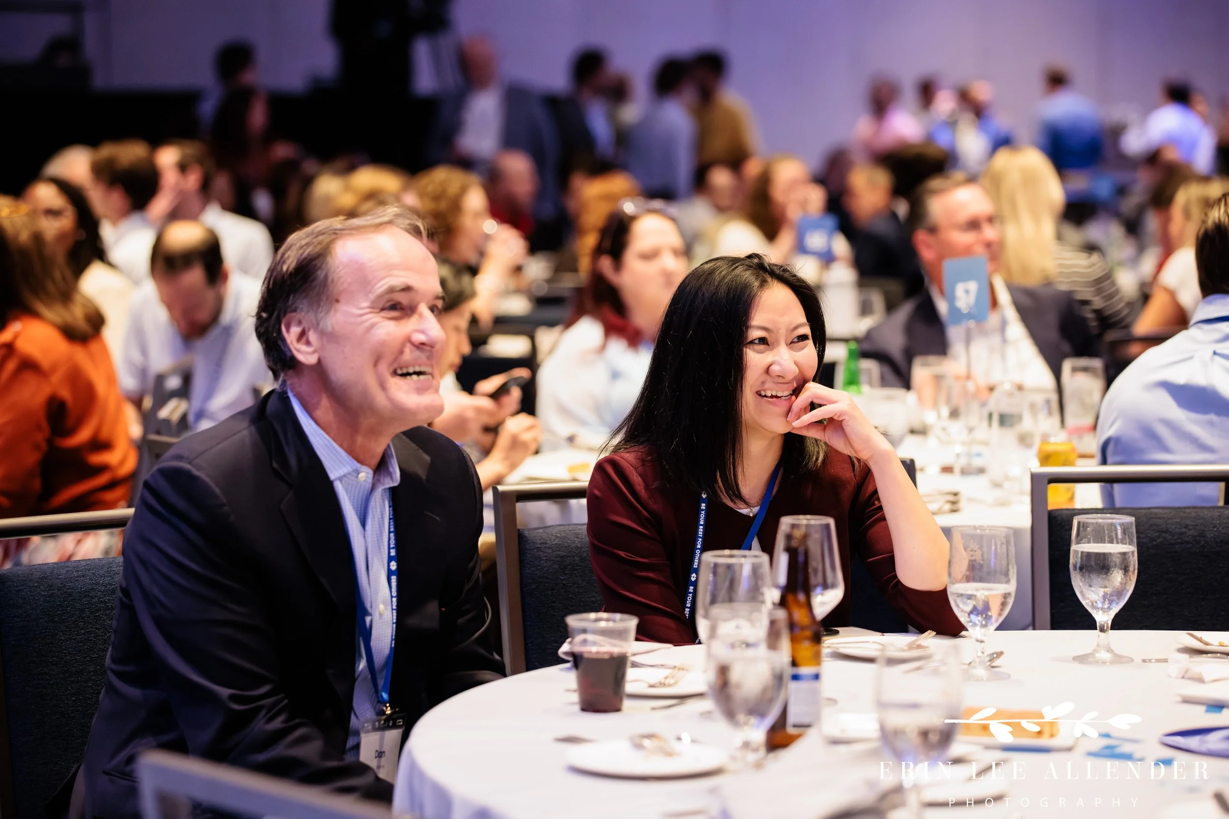 Nashville corporate event photographer capturing guests watching the awards ceremony at RubinBrown's dinner at Gaylord Opryland Resort