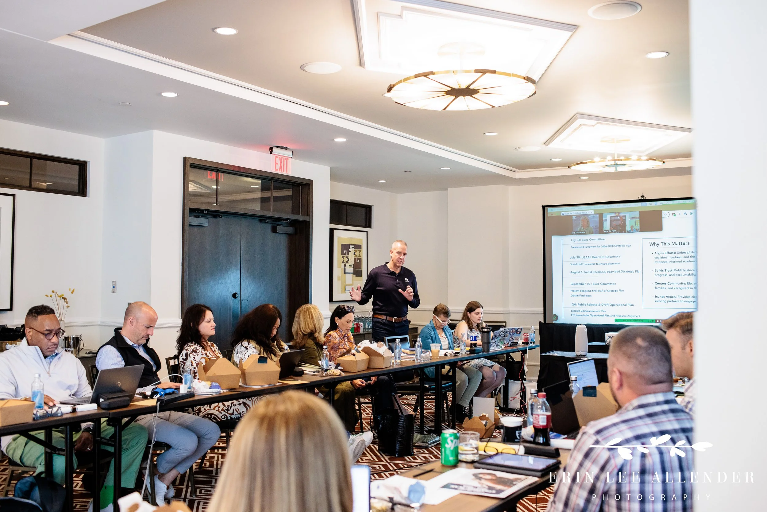 Board members taking notes during the Face the Fight meeting at the Thompson Hotel, Nashville