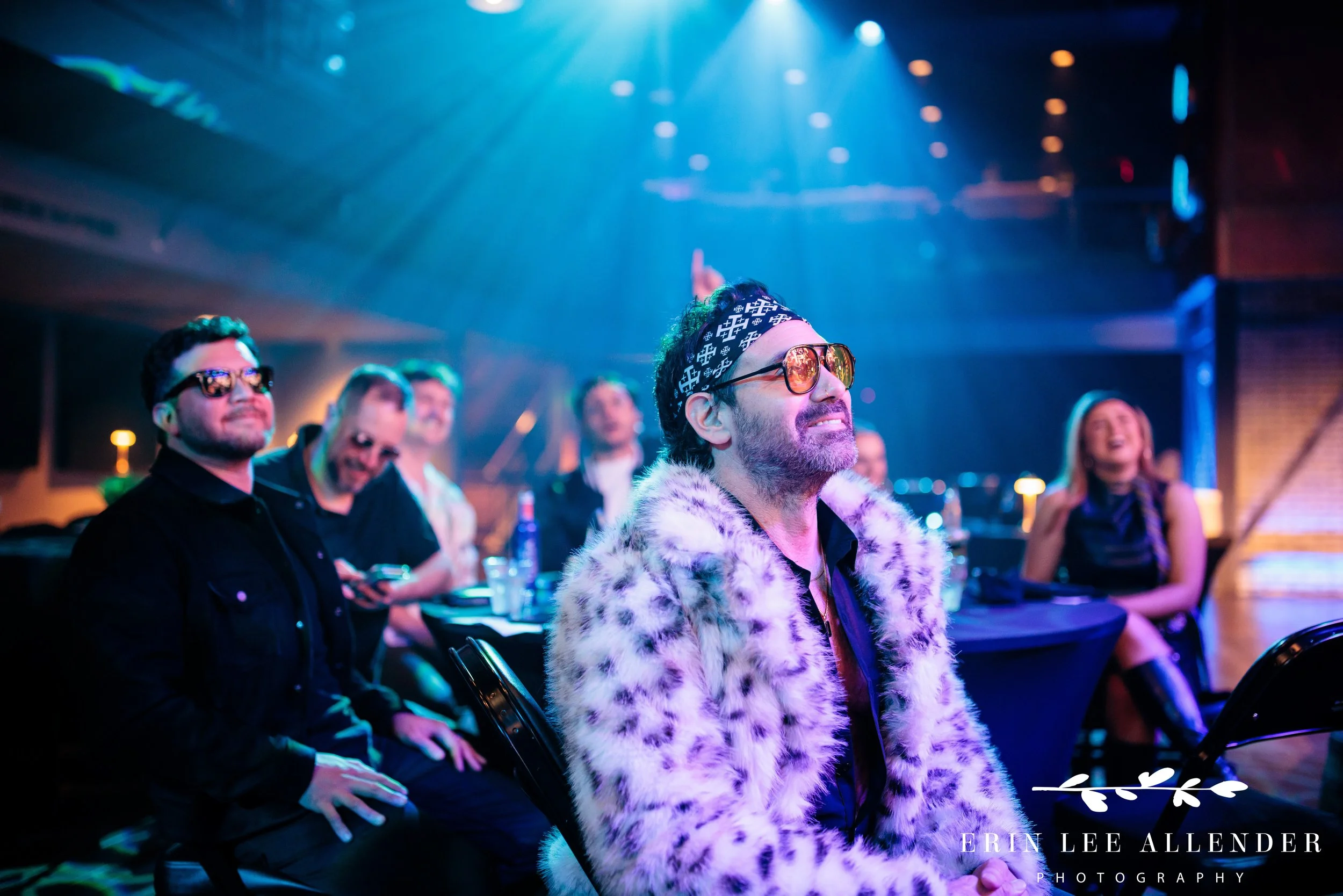 Nashville gala photographer — ambassador's face lit by stage light watching advocacy awards in anticipation, Woolworth Theatre Nashville