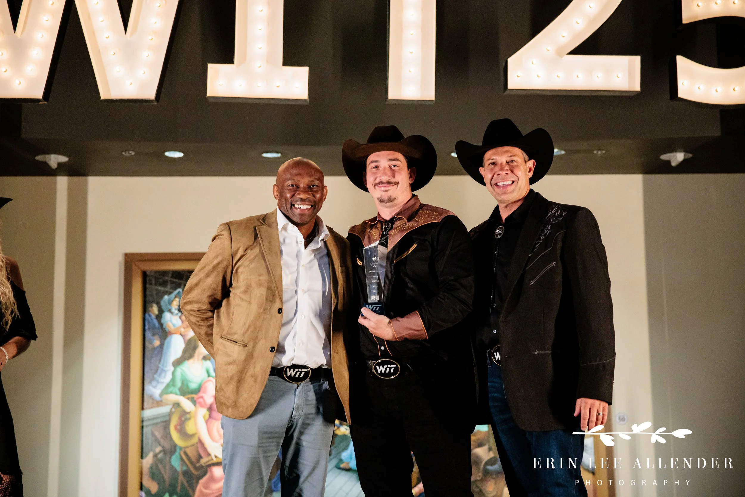 recipient posed with award and executives at Country music hall of fame