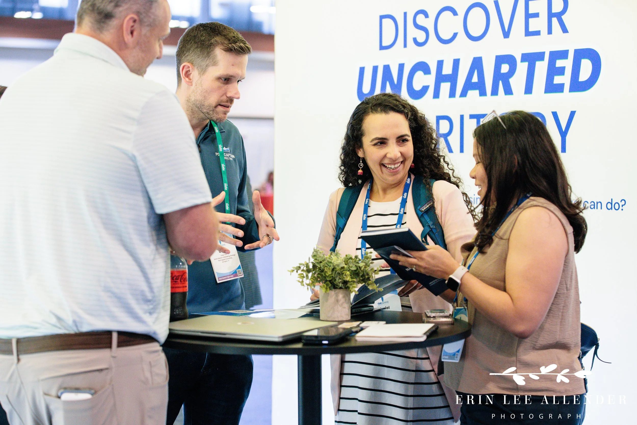 Nashville corporate event photographer — Post Captain consultant talking with attendees in the expo hall at the Slate Summit