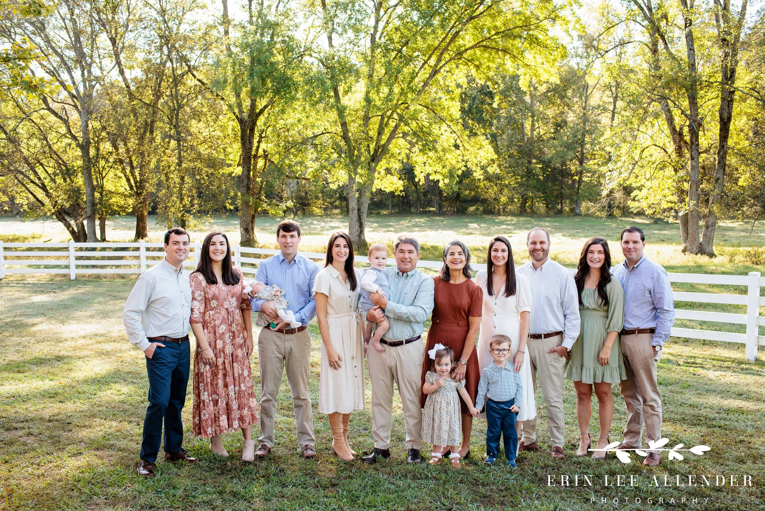 Nashville family photography — full family group photo taken in an open field on a family farm