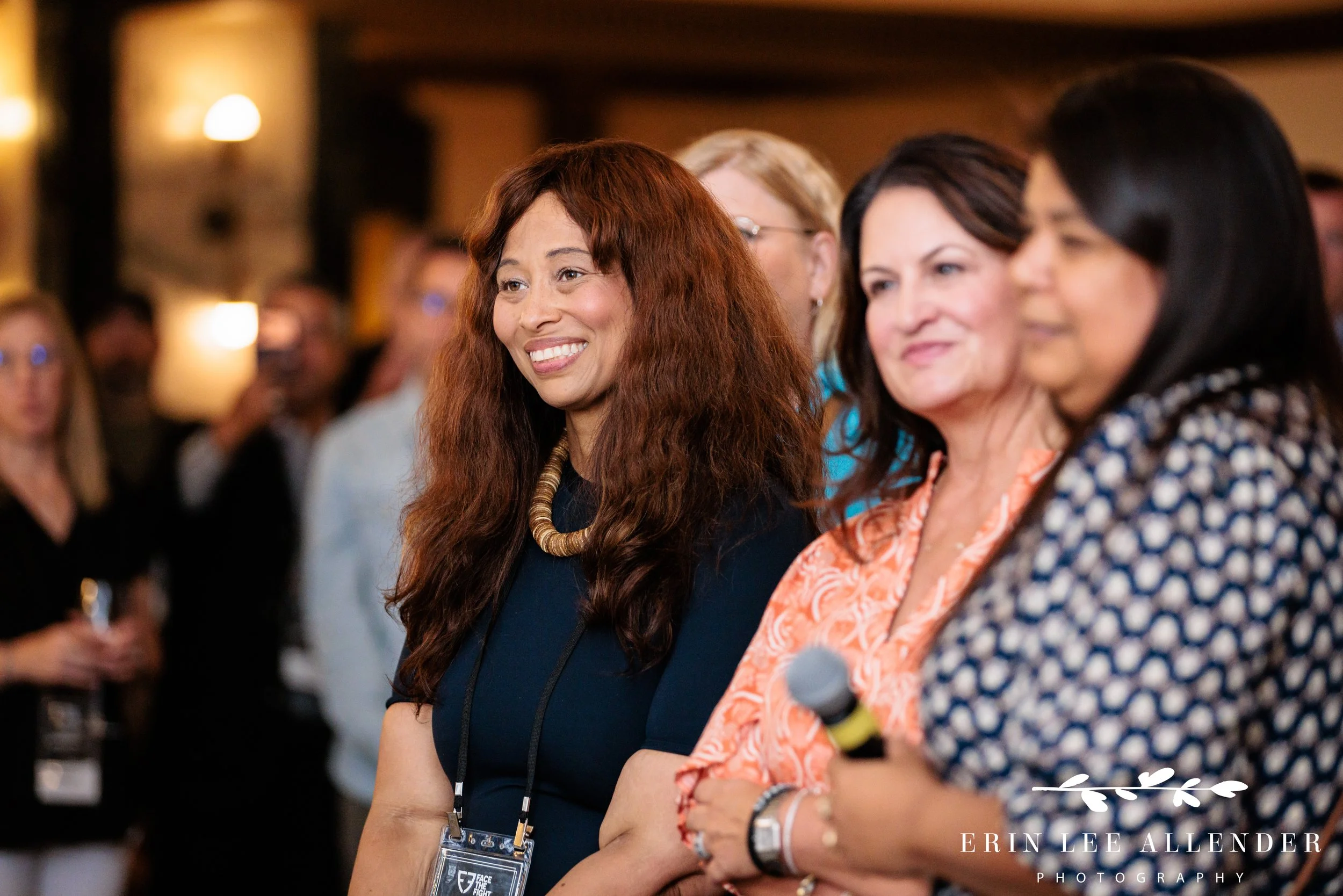 Nashville event photographer — guests smiling during introductions at Face the Fight's opening night at Noelle