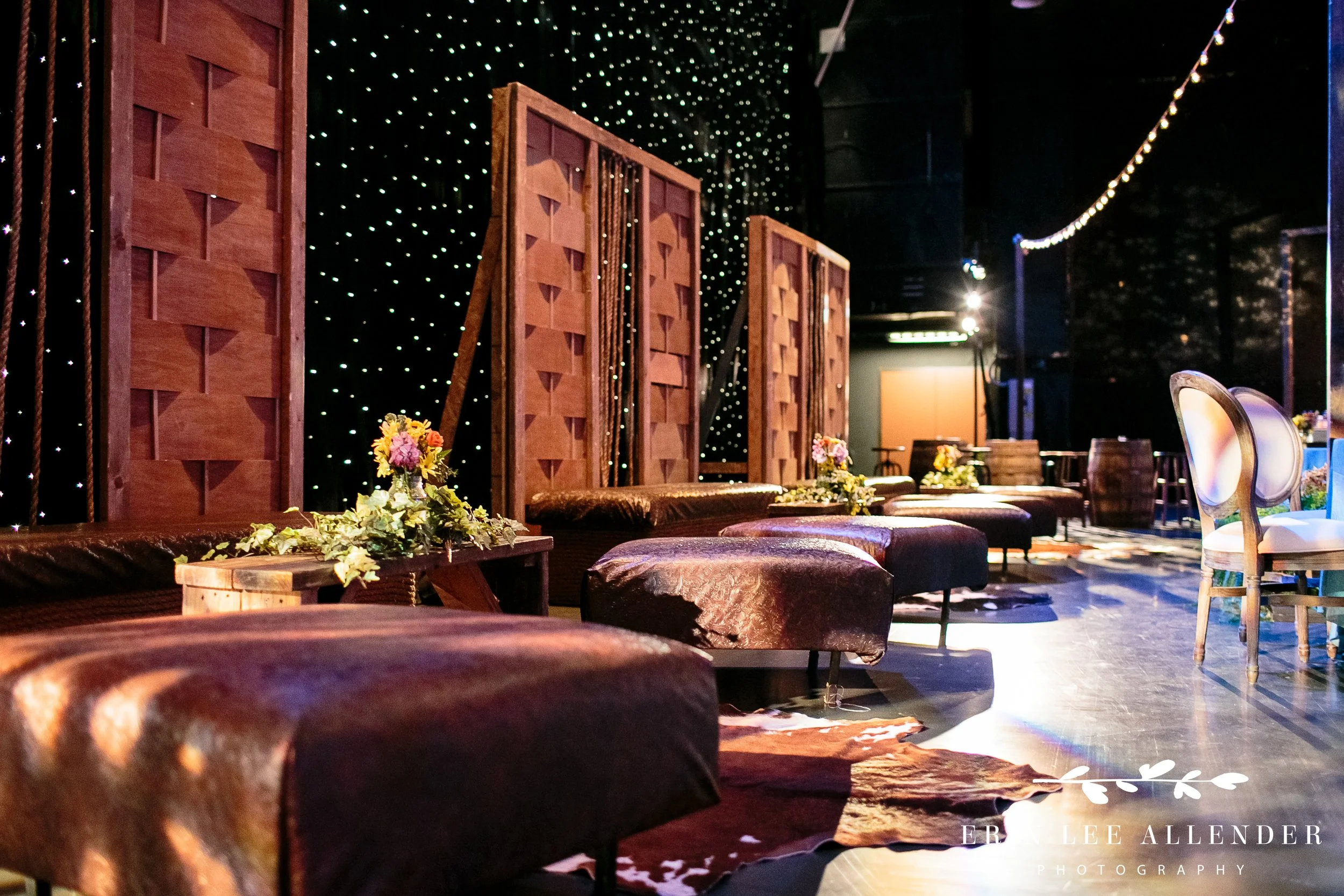 Warm ambient lighting over Grand Ole Opry stage dinner setup with rustic decor Nashville