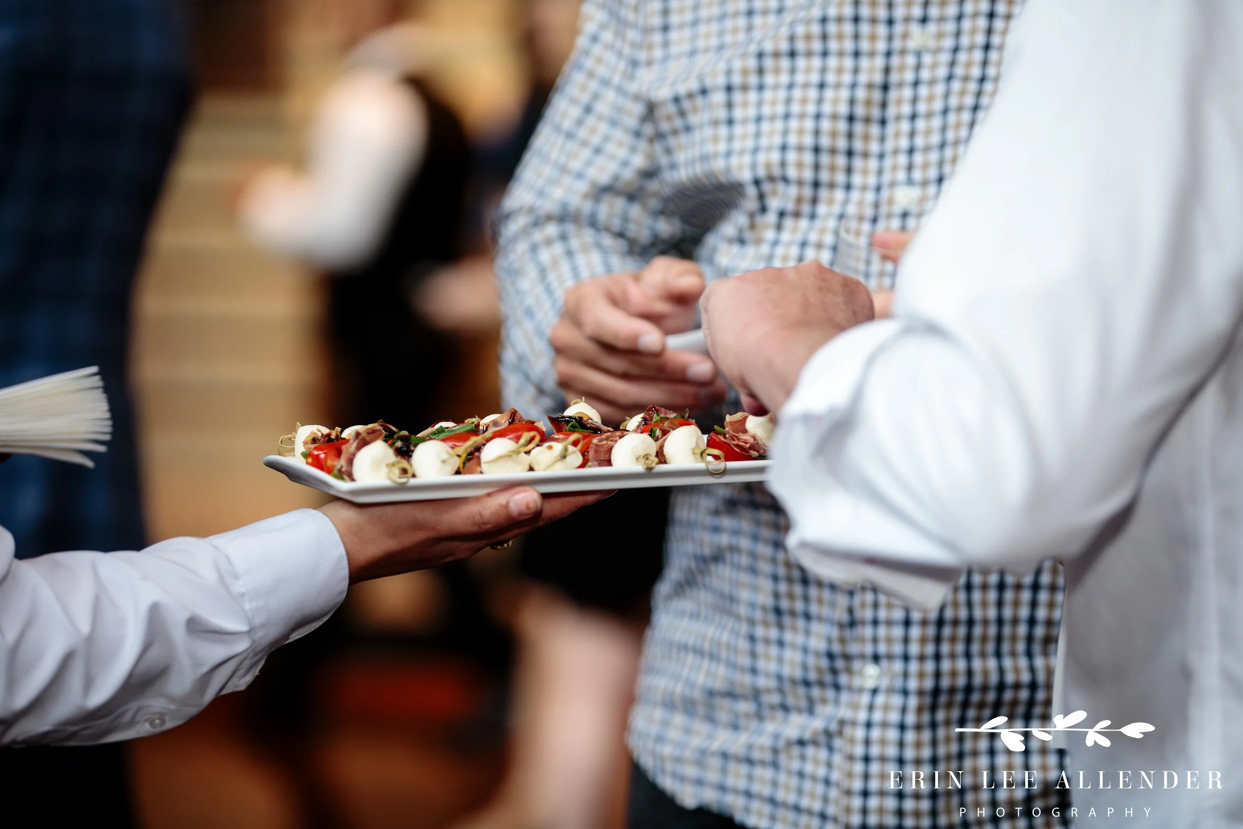 Nashville corporate event photographer — guest grabbing an appetizer at CBIZ Nashville Summit closing party at Country Music Hall of Fame