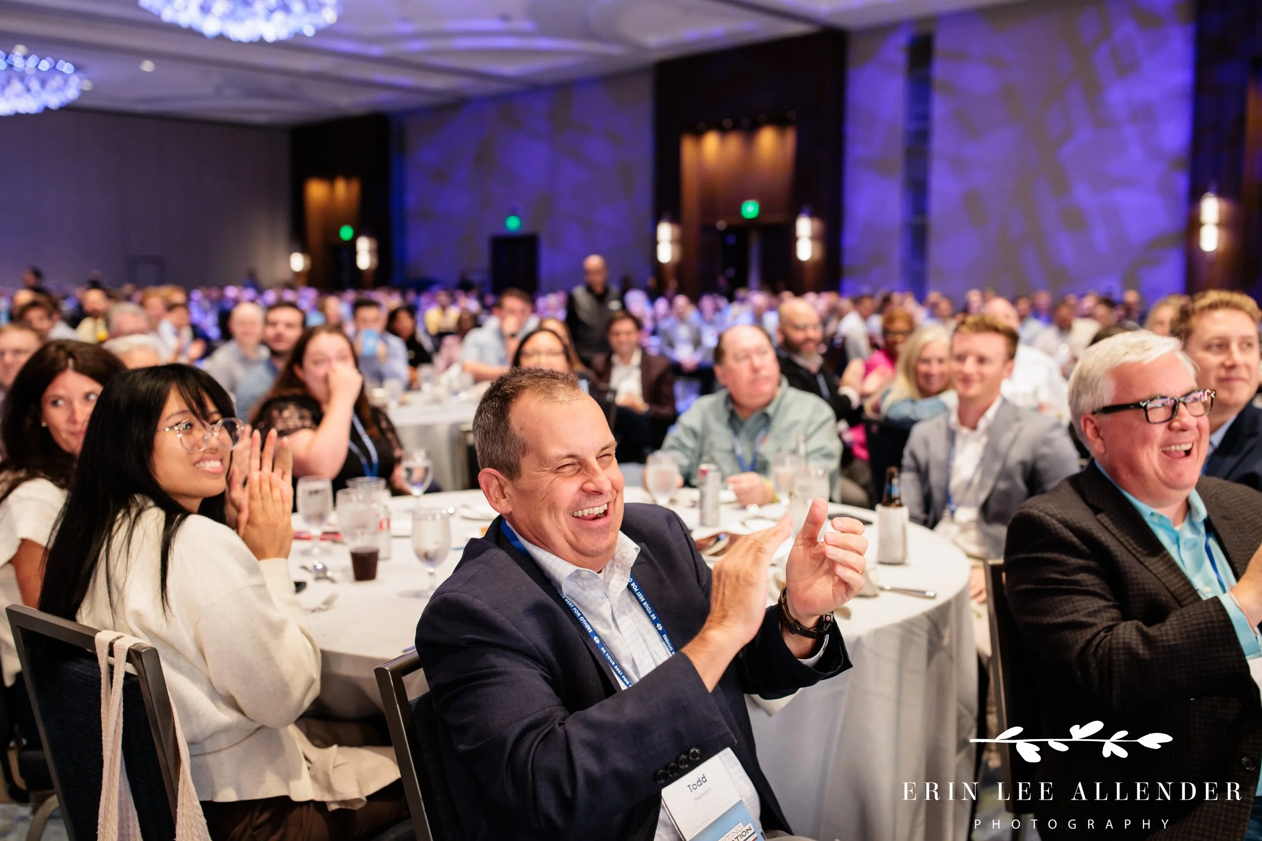 Opryland Hotel corporate event photography of guests clapping for an award recipient at RubinBrown's awards dinner