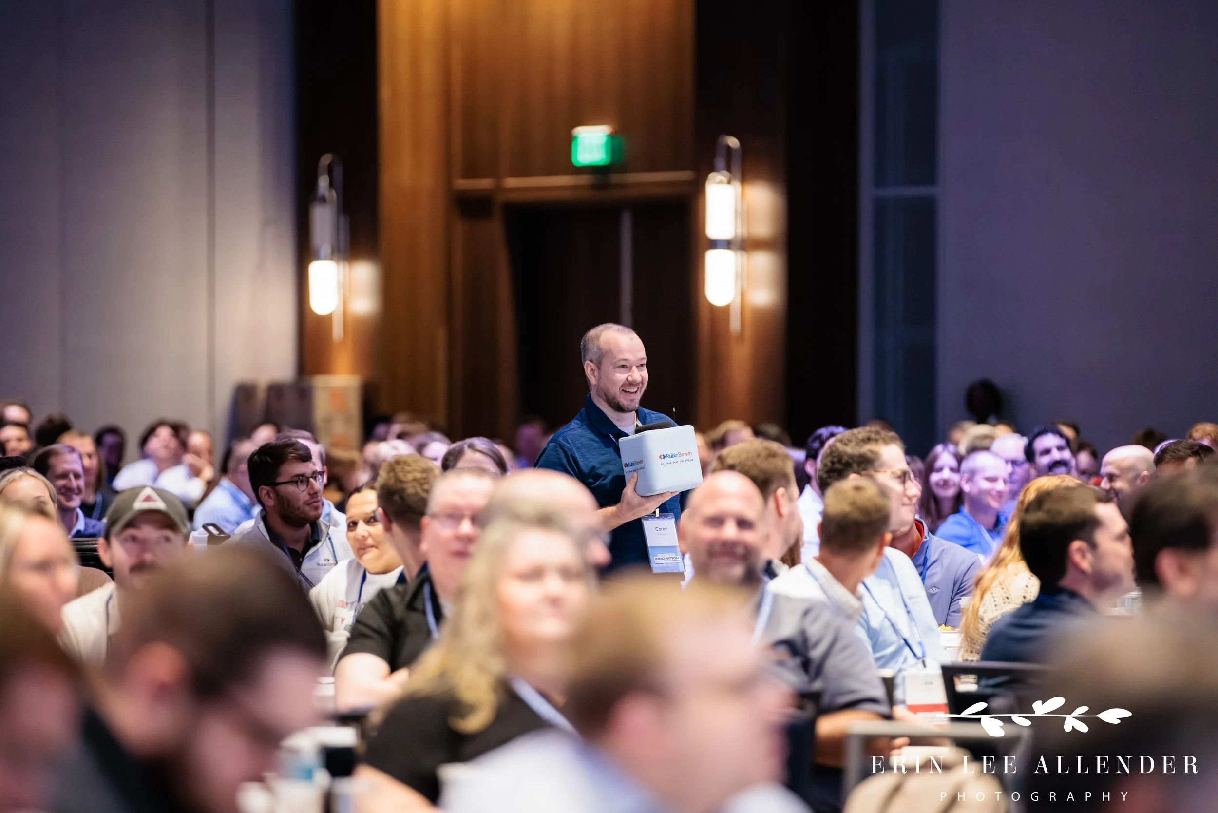Opryland Hotel conference photography of an attendee asking John Sanei a question during RubinBrown's conference Q&A