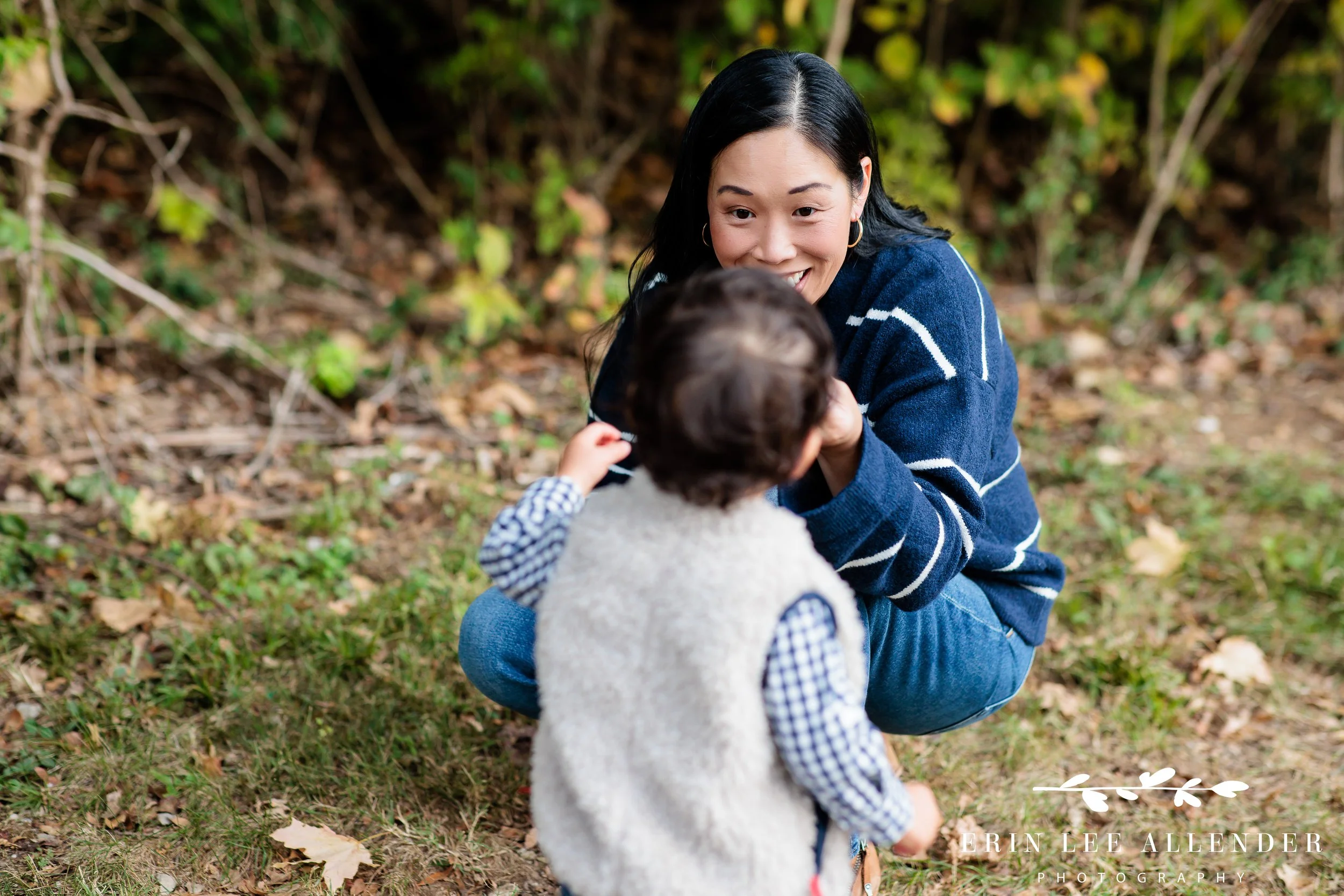 Nashville family photography — mom talking to her one-year-old son during their family session on the Richland Creek Greenway