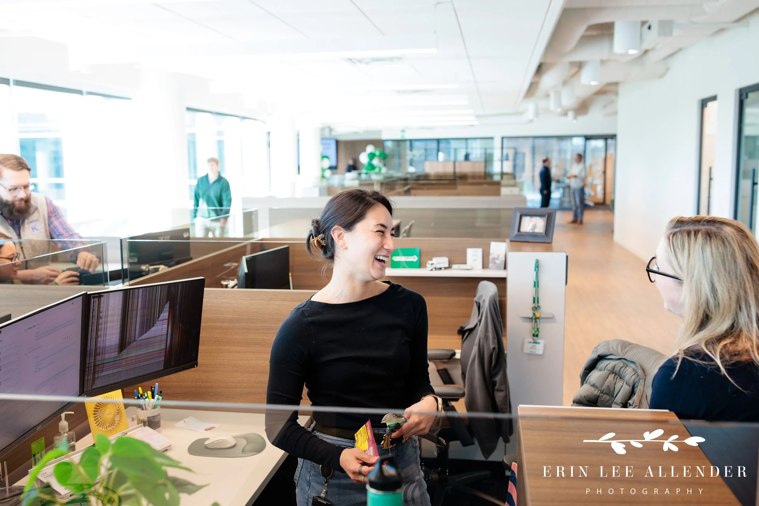 Nashville corporate marketing photography — coworkers laughing together in open cubicle office space at TruGreen