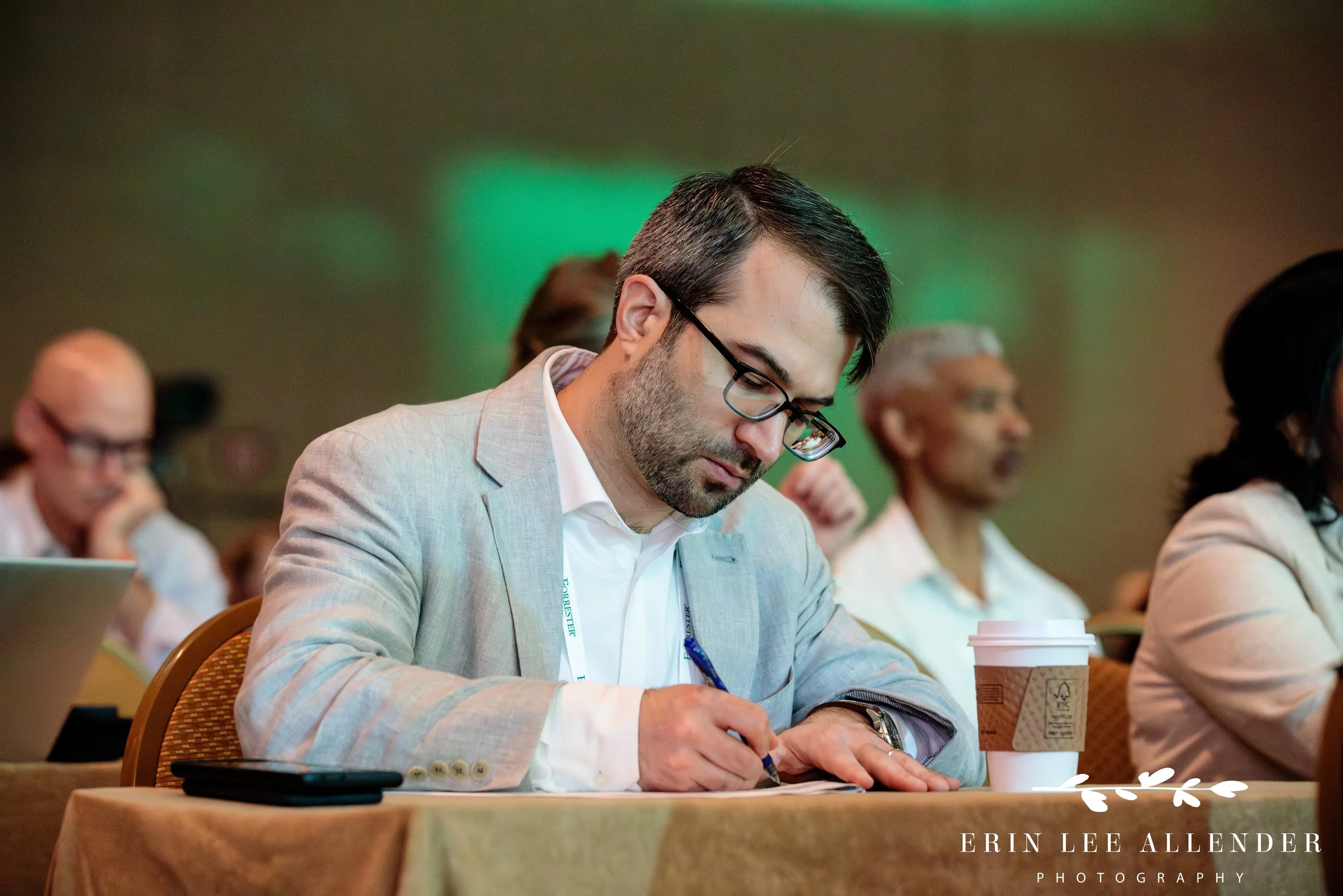 conference-attendee-taking-notes-session-opryland-hotel.jpg