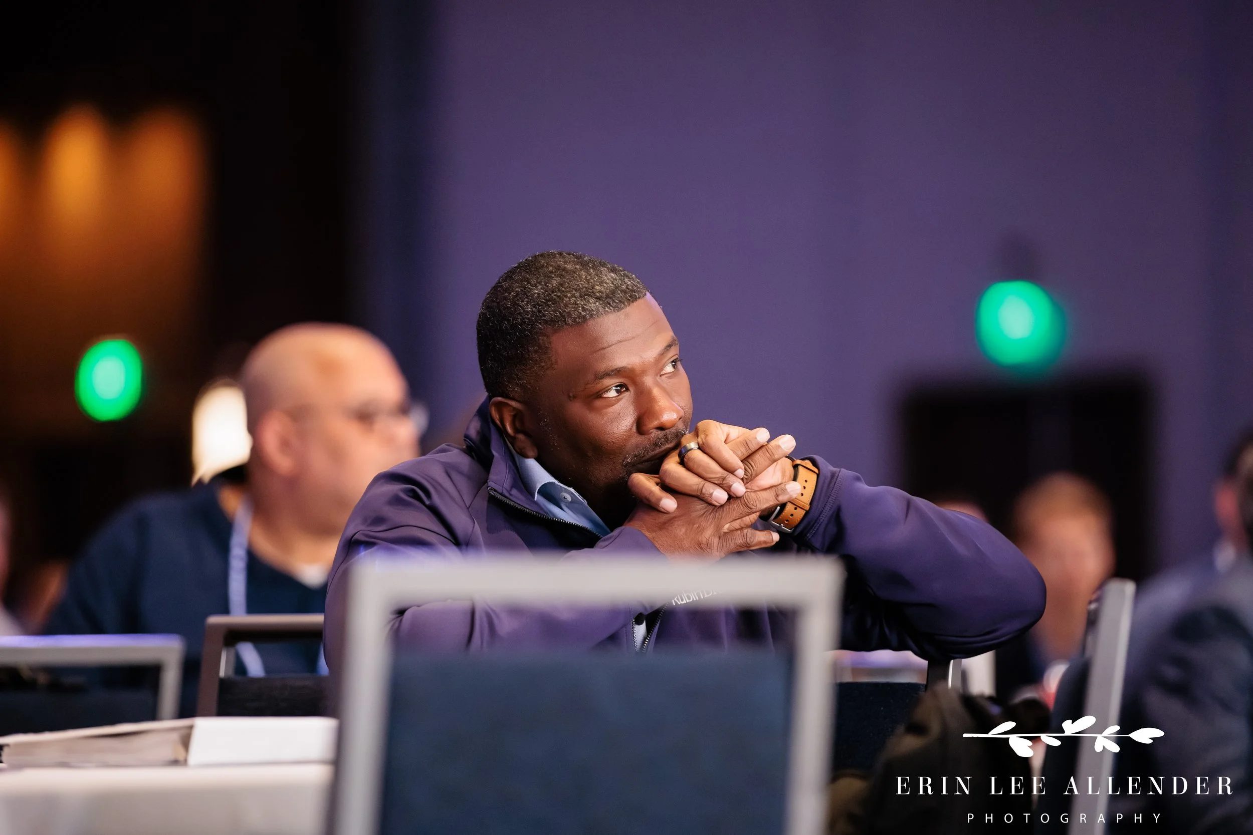 Nashville corporate event photographer capturing a RubinBrown managing partner visibly engaged with a keynote speaker at Gaylord Opryland Resort