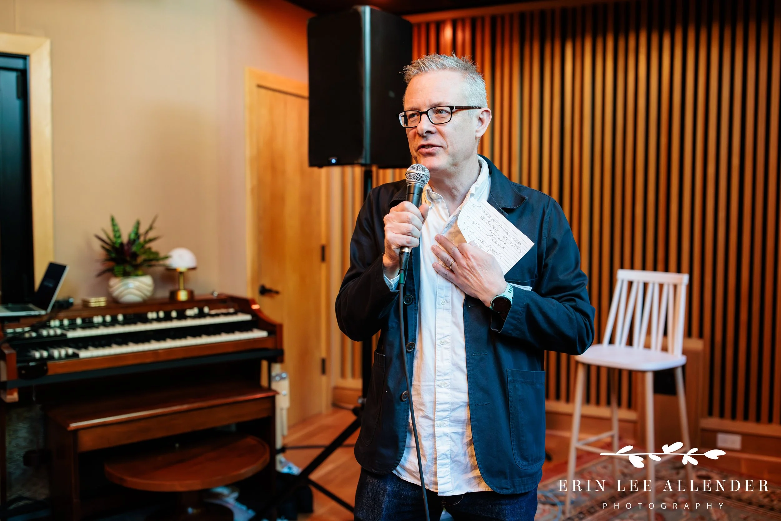 A Save the Music Foundation representative speaks to guests at the fundraiser at Gold Pacific Studios in Nashville