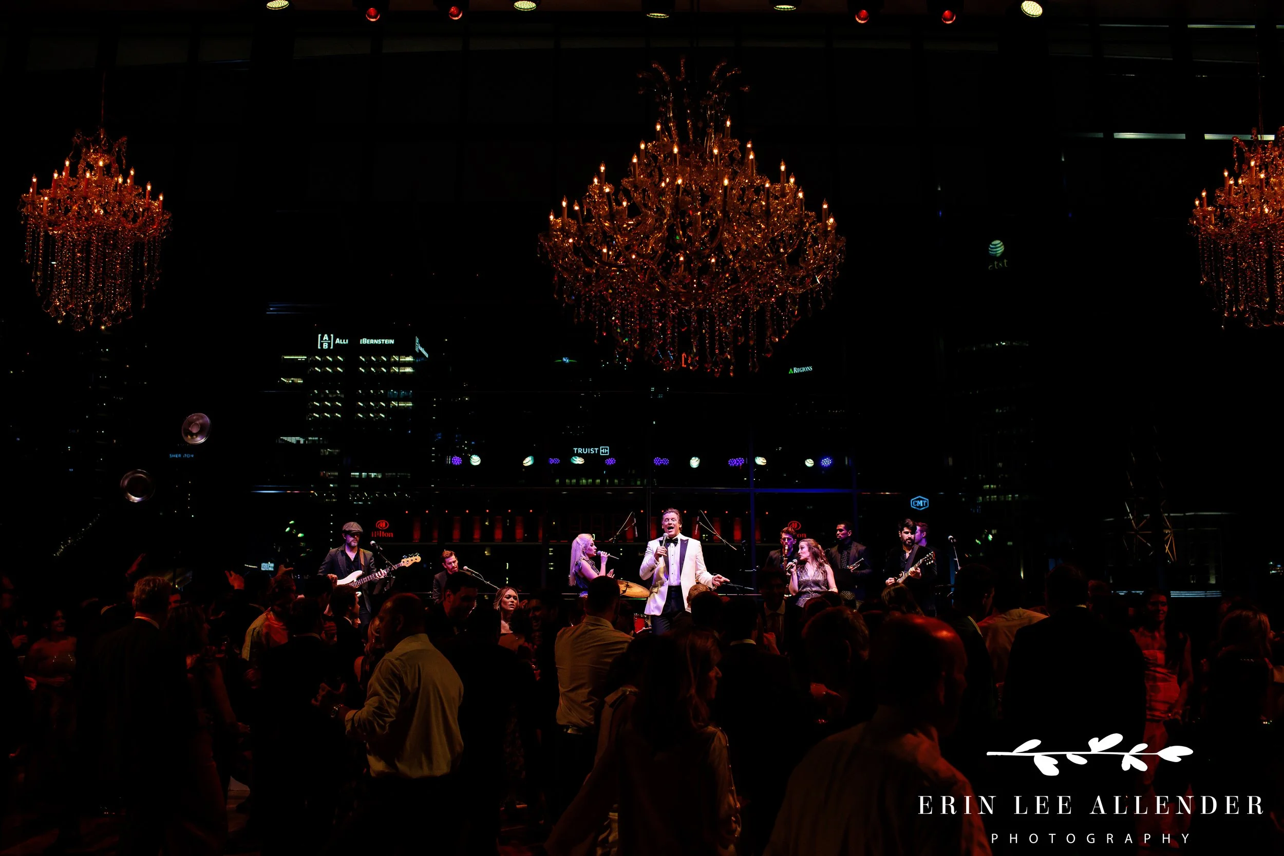Nashville wedding photographer captures groomsmen stretching their suspenders on the dance floor at Country Music Hall of Fame\\\\\\\\\\\\\\