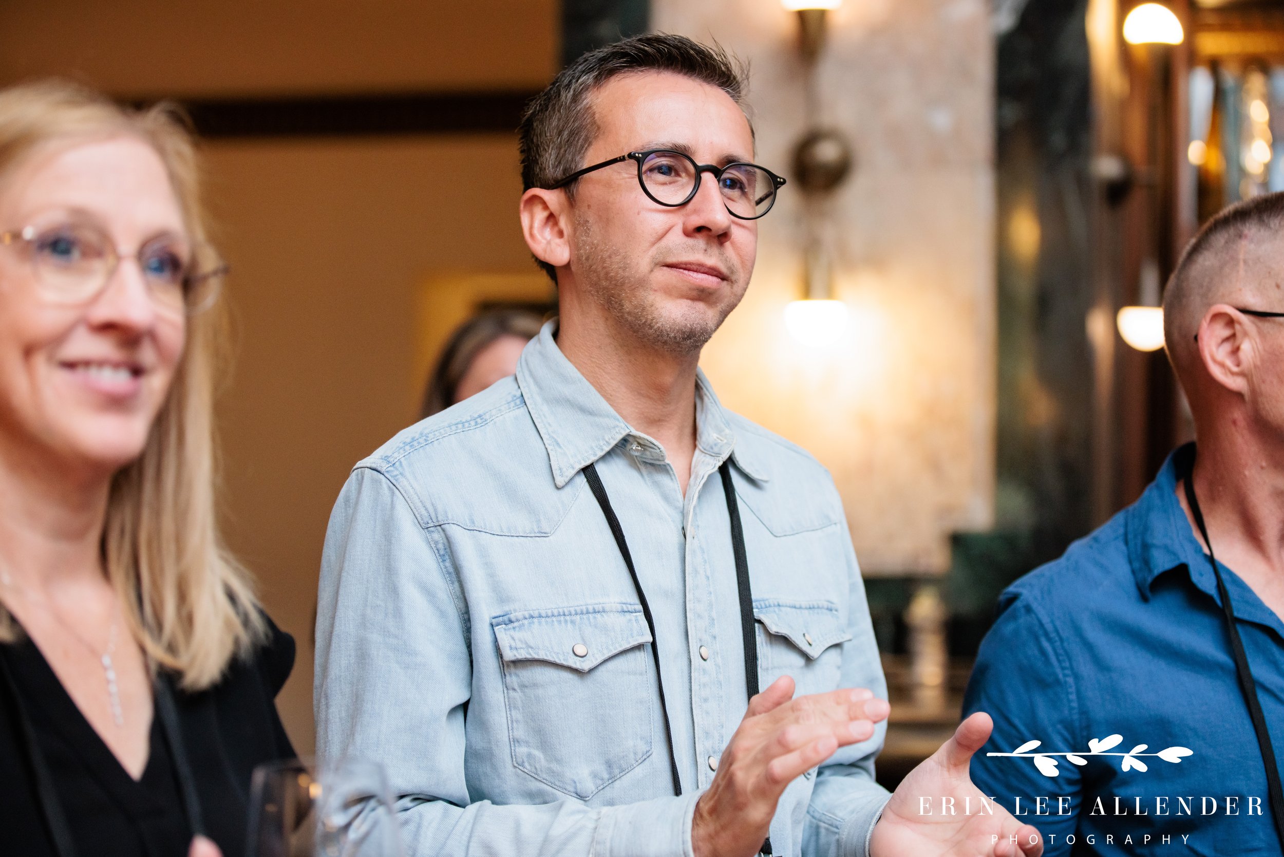 Corporate event photographer Nashville — guest applauding during remarks at Face the Fight's opening night at Noelle